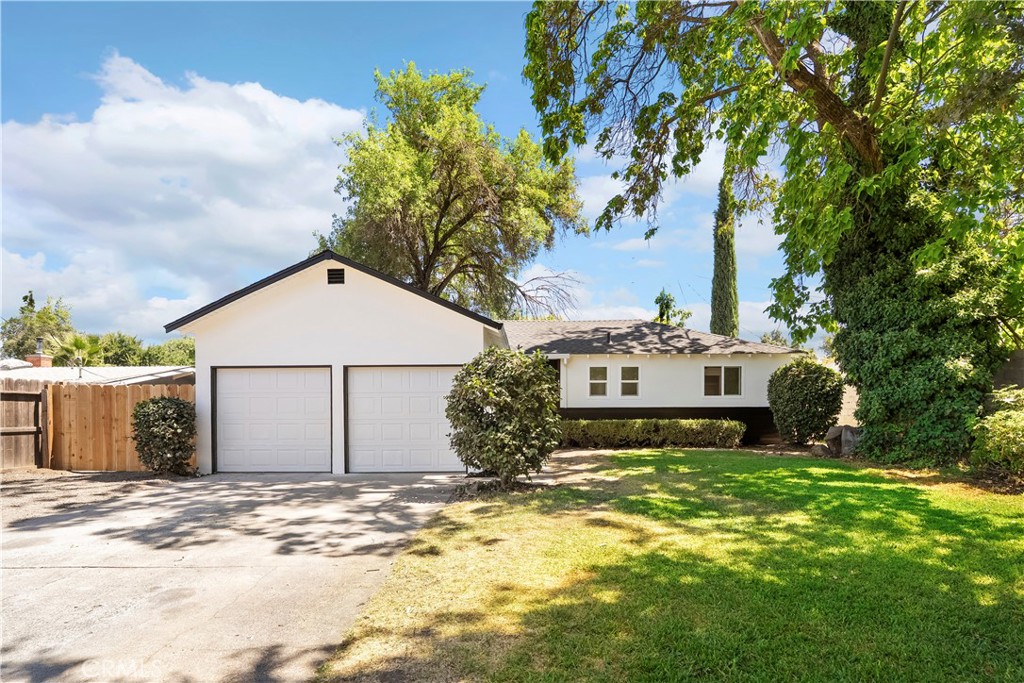 Welcome to 497 White Avenue, where modern style meets move-in ready perfection. This 3-bedroom, 2-bathroom home spans 1,124 sq. ft. and has been fully remodeled from top to bottom with today’s most sought-after finishes, creating a space that’s as beautiful as it is functional. Step inside and you’ll immediately notice the attention to detail, new LVP flooring flows throughout, recessed lighting brightens every corner, and a cozy wood-burning fireplace adds warmth and charm to the spacious living room. The open-concept layout connects the living area to the dining space and stunning kitchen, making it ideal for everyday living and entertaining alike. The kitchen is a showstopper, featuring sleek quartz countertops, modern cabinetry, a gas range, and a sleek glass-vented hood that makes a striking design statement. Over the peninsula, the kitchen opens to the living room, where sliding glass doors lead outside, allowing you to extend your living and entertaining space into the fresh air. All three bedrooms are generously sized, with the two guest rooms offering stylish black ceiling fans. The primary suite is a true retreat with dual closets, a built-in vanity between them, and an en-suite bathroom boasting a walk-in shower with designer tile surround. The hall bathroom mirrors this contemporary style, complete with a light-up vanity mirror and matching tile details for a cohesive, high-end feel. Outside, this property offers plenty of parking, including a 2-car garage, RV or boat parking, and a driveway with room for multiple vehicles. The backyard has just been freshly seeded with grass, creating a green canvas for your personal touch—add a garden, create a cozy lounge area, or keep it open for pets and play. Perfectly positioned in a central Chico location, you’re just minutes from grocery stores, restaurants, coffee shops, the movie theater, and multiple schools. For commuters, quick freeway access makes getting to and from work a breeze. Whether you’re running errands, catching a show, or meeting friends for dinner, everything you need is right at your fingertips. And here’s the best part... you’d be hard-pressed to find another fully remodeled home with modern, designer finishes like this for under $400k in Chico. Stylish, functional, and priced to move… 497 White Avenue is the kind of opportunity you don’t want to let pass you by.