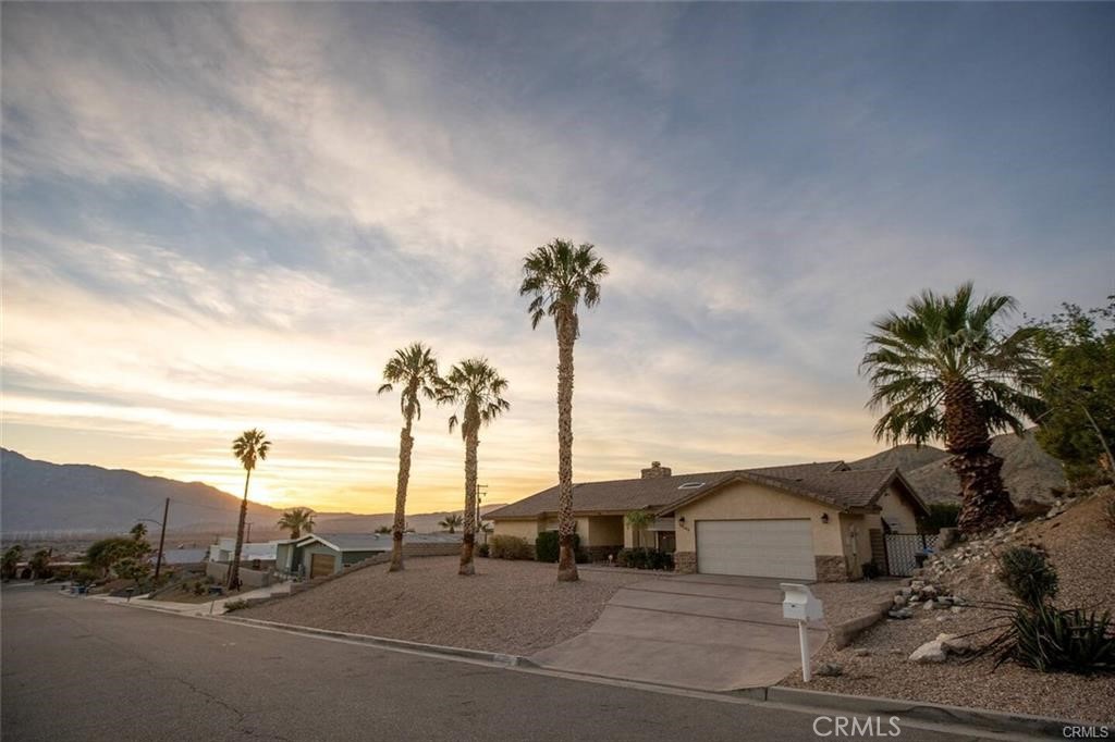 This stunning, fully remodeled home features a spacious and beautifully designed living space, complete with a private, in ground pool and a jacuzzi. The large living room features a high ceiling, charming bay window and flows seamlessly into the open-concept kitchen. The den can be used as a fourth bedroom. The dining room boasts a soaring ceiling, a cozy fireplace and sliding doors that led to the backyard, enjoy breathtaking views of the city, valley, and the iconic San Jacinto and San Gorgonio mountains, along with miles of scenic hillside surrounding the property, enjoy a true sense of tranquility at the top of the hill. The backyard is an entertainer's paradise, featuring fruit trees, a swimming pool, jacuzzi, expansive patio, and a 300-square-foot shed. The home has been updated with new flooring, fresh paint, and modern appliances throughout.