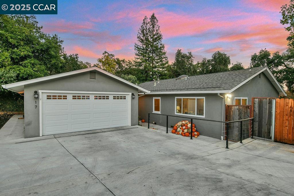 Set on an expansive, flat lot at the end of a quiet cul-de-sac, this home’s outdoor space is a true showstopper. From birthday parties and backyard barbecues to kids playing and pets running free — this yard was made for gathering and creating memories. A spacious wooden deck, attractive paver patio, wide-open lawn, and plenty of room for all your toys and RV parking make it a true entertainer’s dream. Inside, the updated home offers a welcoming flow with a modern kitchen and refreshed bathrooms. The attached in-law unit with its own entrance features a kitchen, living room, bedroom and full bathroom — perfect for extended family, au pair, or rental income. This home comes equipped with leased solar panels — offering significant energy savings for a low monthly payment. You’ll also find an extra-wide driveway, two large storage sheds and double access for convenience. This property is as functional as it is beautiful. Best of all, it’s just a short walk to Pleasant Hill’s top-rated Strandwood Elementary and tucked away on a private road in a serene setting. Discover the perfect blend of seclusion and convenience. Homes like this rarely come to market — don’t miss the chance to make this one yours!