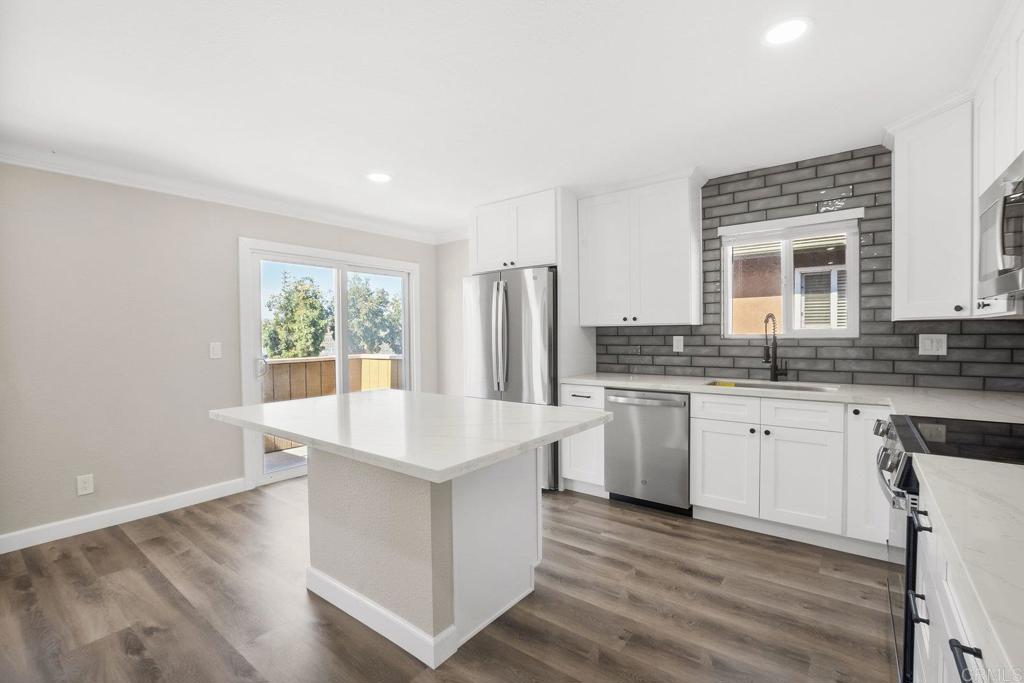 Stunning 3 bedroom turn key Condo in central location! Move in ready and great investment opportunity! Excellent value for home ownership or rental income located within the gated Maple Park Condos. Luxury Vinyl Plank flooring greets you as you enter this open floor plan filled with natural light and high end updates throughout. There are no stairs inside this beautiful unit that includes over 70k of recent upgrades. The remodeled kitchen is a chef's dream featuring gorgeous carrera quartz countertops, designer subway tile backsplash, large undermount sink, and solid wood shaker cabinets paired with stainless steel appliances. Enjoy the modern ambiance created by LED recessed lighting throughout the home and modern ceiling fans for comfort. Both bathrooms have been beautifully updated with new vanities and backsplashes while crown molding and new baseboards add finishing touches throughout. This 1025 square foot gem offers a spacious 3 bedroom, 2 bathroom floor plan perfect for comfortable living or maximizing rental income. Views of the local tennis courts and hills from the master bedroom with en suite bath. Additional highlights include soft close cabinets, new hardware, double paned windows, new outlets, new blinds, and new light fixtures - every detail has been thoughtfully updated! Prime location with easy access to freeways, parks, restaurants, and shopping centers. The gated community provides security and peace of mind. HOA covers water, sewer, trash and no mello roos! You will love this turn key home that's ready for immediate move in. Don't miss this exceptional opportunity!