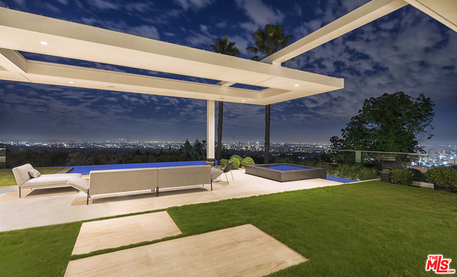 Bel Air's newest & most exciting offering. By far one of the best/most unique promontories w/ panoramic 280 degrees views from DTLA to ocean. Sited on close to 1 acre, completely secluded from street w/ a gated, long drive. Surrounded by the most significant hi-end luxury estates, this 1-of-a-kind, brand new estate is designed by Saota Architecture & is their 1st highly anticipated property in L.A. The design is a departure from the conventional contemp w/ warm finishes/rich textures/chic wall coverings. The use of limestone/wood/steel thru-out provide a sophisticated elegance. Set back w/ lrg motor court & oriented towards explosive views. Great rm, form din rm, designer kitch, study, solarium, wine rm & theater. Master w/ dual baths & large view terrace. 3 additional en-suites upstairs. Indoor wellness center w/ massage therapy area, gym, sauna, steam shower, bath & Zen garden. Outdoor dining rm, infinity pool/spa overlooking a mesmerizing blanket of city lights.