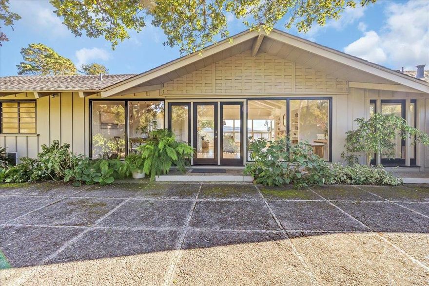 Just right... or so much potential! Perched on a hillside only 5 minutes from downtown Carmel, in the Rancho Mar Monte neighborhood, this single level 2-bedroom, 2-bath home sits on over half an acre with views of Point Lobos. The bright, south facing interior captures the natural beauty beyond, while the North side opens to a private garden sanctuary. A vaulted living room ceiling enhances the sense of space, while a cozy gas log fireplace adds warmth and charm. An attached 2-car garage, with washer and dryer, provides convenience. With an intimate setting, immediate comfort, plus ample room to expand, this property presents a rare opportunity for the best in coastal living in one of the Monterey Peninsula's most sought - after locations.