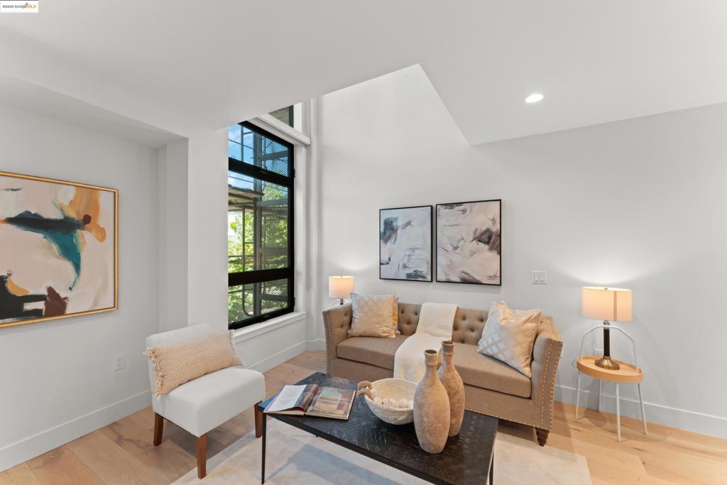 Modern and light-filled 1BD/1.5BA condo in vibrant Southwest Berkeley. This stylish unit features wide-plank hardwood floors, high ceilings, and an open layout filled with natural light. The kitchen flows into the living space, perfect for entertaining or relaxing. The spacious bedroom includes an en-suite bath, and a half-bath adds convenience for guests. Enjoy direct access from the elevator landing—no long hallways! Includes one dedicated parking stall, secure bike storage, and access to a rooftop patio with city views. In-unit laundry and secure building entry add comfort and ease. Ideally located minutes from UC Berkeley, Fourth Street shops, BART, and freeway access.