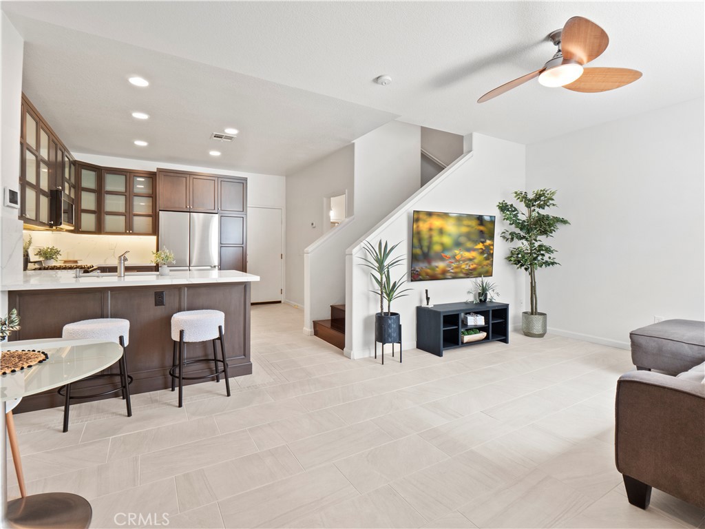 Welcome to this beautifully upgraded home in the gated Oak Lane community of Circle J Ranch. This 3-bedroom, 2.5-bath residence offers open-concept living with a spacious private patio and a 2-car garage equipped with storage, overhead rack, and 240 EV charging. The light-filled living and dining area features upgraded tile flooring, while the stunning kitchen boasts custom cabinetry with under-cabinet lighting, custom cabinetry inserts, white quartz countertops, and stainless steel appliances. A guest powder room completes the main level. Upstairs, find upgraded vinyl flooring, skylights that bring in amazing natural lighting, a built-in desk perfect for an office or homework station, a large linen closet, and laundry area. The spacious primary suite includes a walk-in closet with custom storage and a beautifully upgraded tile shower with glass enclosure. Two additional bedrooms, one with a walk-in closet and organizers, share a full bath. Enjoy outdoor entertaining on your private patio or explore Circle J Ranch Park, right next door. Community amenities include a secure gated entrance, resort-style pool and spa surrounded by lush greenery, exterior maintenance, and ample guest parking. Best of all, this home is near restaurants, shopping, Henry Mayo Hospital, easy freeway access and there’s No Mello Roos taxes! Move-in ready and a must-see!