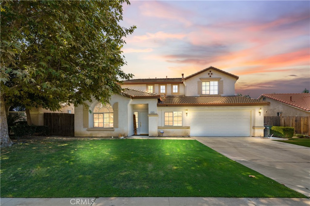 Welcome to River Run in Southwest Bakersfield! This spacious 5 bedroom, 3 bath home offers a versatile floor plan designed for comfort and convenience. The downstairs bedroom with a private bath is perfect for guests or multigenerational living. Enjoy the formal living and dining rooms, plus a bright open-concept kitchen and family room with 10-foot ceilings. Recent updates include newer flooring, fresh paint, and modern appliances. The large backyard features a generous grass area, ideal for entertaining or play. Additional highlights include an indoor laundry room with storage and plenty of space for everyone. Don't miss this opportunity to own in the desirable River Run neighborhood!
