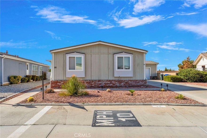 Welcome to this beautifully maintained manufactured home located in the Vista Del Rosa senior community (55+), Apple Valley. This spacious home offers 4 bedrooms and 2 full bathrooms in a split floor plan, with 1,782 sqft of comfortable living space.

Enjoy a charming, covered porch.  Inside, you'll find a warm entry with updated flooring, a large living room, and a cozy family room with a corner fireplace featuring a mantle and tiled hearth.

The kitchen is bright and functional, the primary bedroom is roomy and inviting, with a private bath featuring a garden tub and step-in shower. On the opposite side of the home are three additional bedrooms and a second full bath.

The home also includes a 2 car- attached garage with access to the back yard, dual-pane windows throughout. The home is part of a gated 55+ community, which offers amenities and a mature neighborhood feel.

Don't miss this opportunity to own a generous, well-designed home in Vista Del Rosa-a place you'll be proud to call yours.