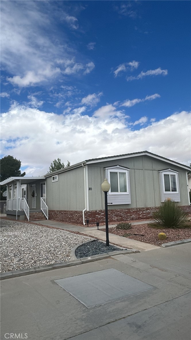 Welcome to this beautifully maintained manufactured home located in the Vista Del Rosa senior community (55+), Apple Valley. This spacious home offers 4 bedrooms and 2 full bathrooms in a split floor plan, with 1,782 sqft of comfortable living space.
Enjoy a charming, covered porch. Inside, you'll find a warm entry with updated flooring, a large living room, and a cozy family room with a corner fireplace featuring a mantle and tiled hearth.
The kitchen is bright and functional, the primary bedroom is roomy and inviting, with a private bath featuring a garden tub and step-in shower. On the opposite side of the home are three additional bedrooms and a second full bath.
The home also includes a 2 car- attached garage with access to the back yard, dual-pane windows throughout. The home is part of a gated 55+ community, which offers amenities and a mature neighborhood feel.
Don't miss this opportunity to own a generous, well-designed home in Vista Del Rosa-a place you'll be proud to call yours.