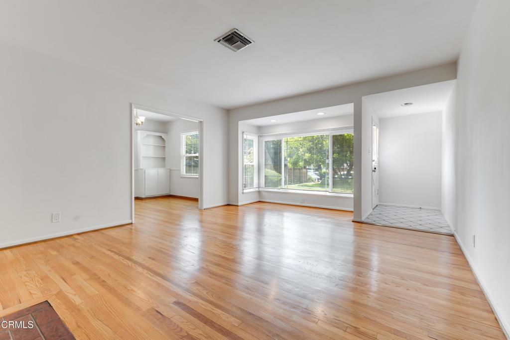 This charming 2-bedroom, 1.5-bath home with a den is located in the desirable Valley Village neighborhood near Burbank Blvd and Laurel Canyon. Inside, you'll find beautiful hardwood floors, custom built-ins, and two cozy fireplaces. The updated kitchen features new cabinets,countertops and stove. The home includes a laundry room with full-size washer and dryer. Both bedrooms are bright with hardwood floors and large closets. The den can serve as an office, family room, or third bedroom. The home offers nearly 1,300 sqft. of living space with an inviting layout that blends comfort and functionality. Outside, enjoy a large private backyard with a patio and a spacious two-car garage. With easy access to restaurants, shops, and major freeways, this Valley Village gem combines charm, convenience, and privacy.