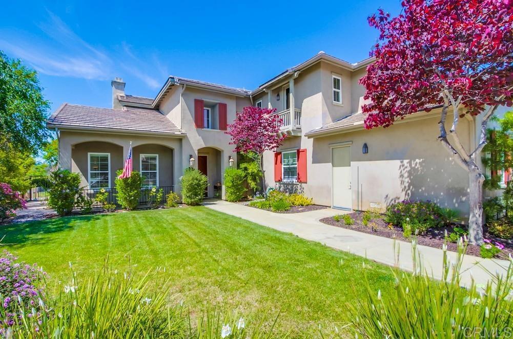 Stately Peppertree Park home with fully paid solar welcomes you to the most peaceful location in this beautiful neighborhood. Primary and 2 secondary suites (including 1 downstairs) combined with jack-n-jill bedrooms make this an amazing and luxurious multi-generational opportunity with direct bath access from each bedroom as well as a half bath downstairs, 3-car garage and long driveway. The inviting entryway with soaring 20ft. ceiling opens to the formal living room - designed around the home’s first fireplace - and formal dining room (new French doors open to the backyard). The great room is truly the heart of this home featuring a kitchen with acres of granite countertop space including the expansive 4 X 8 island. The family room is equipped with the home’s second fireplace and built-in entertainment cabinet. Upstairs, bask in the luxurious, oversized primary suite. The large bathroom features neutral (off-white) slate tile flooring, double sink vanity topped with slab Crema Marfil counter, modern, black-framed mirrors, hardware and lighting fixtures, and a deep soaking tub. You will be wowed with the step-in shower of your dreams with floor to ceiling tiles, double rain-type shower heads, and stainless-steel fixtures. You may never want to leave. Through the bath, find the spacious walk-through primary closet, which includes shelving and drawers, providing plenty of room for any wardrobe. The downstairs secondary suite is perfect as an office, guest room or gym. Light pours in from two directions and features mirrored closet doors. The ensuite has updated hardware and lighting (as do all the bathrooms), and a door leading to the backyard - perfect for easy bathroom access when entertaining outdoors. Step out to a shaded lanai to protect you from the sun while you enjoy the Fallbrook breeze during your afternoon meals. Lush mature landscaping and two raised gardens irrigated with a drip system help to reduce watering costs. A firepit is located in the corner of the backyard (which has plenty of room to add a pool). The function and finishes throughout this home will WOW you; chef’s kitchen complete with top end appliances and continental-sized island, huge upstairs primary suite with view balcony, downstairs junior suite, gorgeous flooring, plantation shutters throughout, three fireplaces, and a spacious 3 car garage. You will be amazed to see this home in person. Enjoy this wonderful neighborhood from the moment you drive through the front gate and through the canopy of trees that welcome you home; take a walk with friendly neighbors on the walking trails throughout the 6 acre park; take your kids to the basketball court or the playground; or meet friends at the local tennis club for tennis or pickleball. Home also includes fully paid solar array, two high-efficiency AC units, hardwood flooring downstairs, luxury vinyl plank flooring upstairs, and a 3 car garage. This is a home that has been filled with love from the day it was built and a family that hopes it will be filled with the love of new owners.