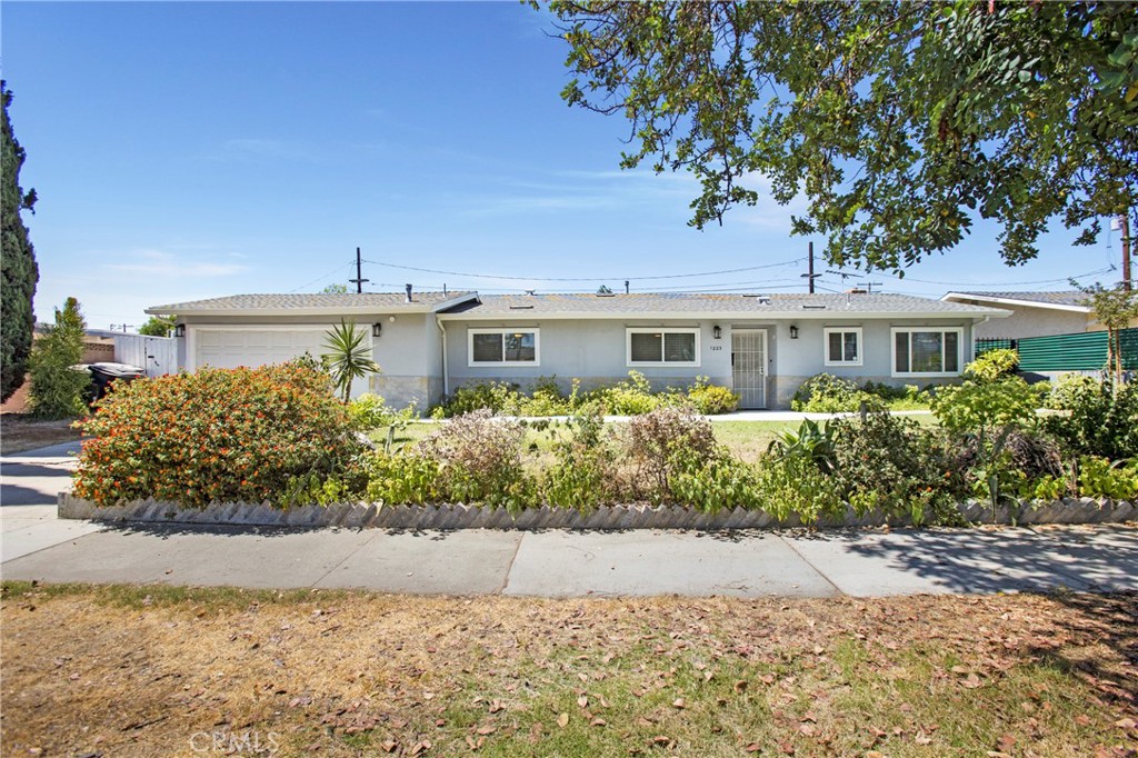 This beautifully remodeled 4-bedroom, 2-bathroom single-family home offers privacy, space, and modern living with the unique option of both residential and commercial use. The versatile floor plan features three distinct living areas, ideal for multigenerational living, a home-based business, or rental income. The brand-new kitchen shines with quartz countertops, custom cabinetry, stainless steel appliances, and a stylish backsplash. An open-concept design is enhanced with waterproof hybrid resilient luxury vinyl plank flooring, an upgraded fireplace with hidden LED lighting, and fresh interior and exterior paint. All rooms are equipped with ceiling fans for comfort and energy efficiency, and the laundry area is conveniently located in the garage. The backyard is built for entertaining, showcasing a resurfaced pool, covered patio, mature citrus trees, and full block wall fencing for privacy. Situated on a 7,215 sq. ft. lot, the home provides approximately 1,418 sq. ft. of thoughtfully designed living space. Additional highlights include dual-pane windows, aluminum tile roofing, and a two-car garage with dual side-opening doors—offering extended space for parking, a boat, or a trailer. Conveniently located near shopping, dining, and major freeways, this move-in-ready property seamlessly blends residential charm with commercial versatility, presenting a rare opportunity to live, work, and invest all in one.