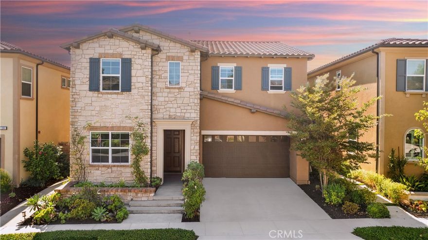 Elegantly refined and beautifully maintained, this single-family residence by Toll Brothers is nestled within the gated Parkside community in Lake Forest. Highly desirable two-story floor plan offers 5 bedrooms plus a loft and 4 bathrooms, including a convenient main-floor bedroom and full bath. Ideally oriented with a south-facing backyard, the home is filled with rich, natural light that elevates every living space. A welcoming entry hallway opens into expansive interiors that flow effortlessly between the great room, dining area, and chef’s kitchen, creating a warm and connected environment perfect for everyday living and entertaining. Gourmet kitchen showcases an oversized center island, upgraded stainless-steel KitchenAid appliances, and extensive warm-tone shaker cabinetry that provides abundant storage with a clean, polished aesthetic. Upstairs, a generously sized loft offers remarkable versatility—ideal as a second family room, study lounge, media retreat, or work-from-home space. Luxurious primary suite features dual vanities with upgraded counters and cabinetry, an extra-large frameless walk-in shower, and a custom-designed walk-in closet offering exceptional organization. An en-suite guest bedroom enhances privacy, while two additional secondary bedrooms share a stylish Jack-and-Jill bathroom with thoughtful layout and convenience. Refined interior appointments include customized Hunter Douglas modern light-filtering roller shades (motorized in the living room and primary bedroom), a crystal chandelier, recessed lighting, wood-look tile flooring on the main level, solid hardwood upstairs (no carpet), a whole-house water softener, and a kitchen sink filtration system. Both front and rear outdoor areas feature low-maintenance landscaping, tile hardscape, and tastefully arranged greenery, while the covered California room with a motorized screen extends indoor-outdoor living and offers a peaceful retreat year-round. Located directly across from the renowned 86-acre Lake Forest Sports Park and Recreation Center—featuring soccer fields, basketball courts, baseball diamonds, and a 27,000 sq. ft. gymnasium—this residence enjoys exceptional recreational access. With low HOA dues, no Mello-Roos taxes, and proximity to shopping, dining, major employment centers, transportation corridors, and scenic trails, it delivers a rare blend of comfort, sophistication, and convenience in a highly sought-after setting.