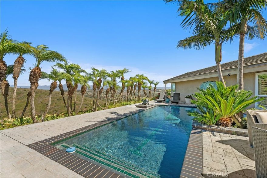 Perched at the top of Sea Island Drive in Monarch Bay Terrace, this one-of-a-kind 2,740 square foot, single level home is Private and Filled with Good Vibes. Situated on an oversized 18,145 square foot lot, with stunning Panoramic Views, Truly a Special Place to call Home. The Spacious and Quiet outdoor area in back has a Beautiful Pool and is surrounded with Forever Views of the Garden, Mountains and Ocean. Sliding glass doors provide access to the Pool from the Sunroom and Kitchen. A Private Deck, off the Primary bedroom overlooks Fruit Trees, the Mountains and the Ocean with convenient access to the pool. This Mid-Century home is a treasure, truly a single level home, with “good bones”, and Vaulted Ceilings throughout. Mature and Lush Landscaping surround the property with Vibrant Plantings found outside each room throughout the house. You cannot create these Serene Spectacular and Private Views, refreshing Ocean Breezes and Phenomenal Sunsets, you can however, Enhance Them! An Amazing Property Filled with Opportunity and Options is Prime and waiting for your Imagination to Recreate It. South of Monarch Bay Terrace you are minutes from Salt Creek and Strands Beaches, The Ritz Carlton, The Waldorf Astoria and the Dana Point Harbor (currently undergoing a multi-million dollar revitalization project) expected to be completed in 2028. To the North you are minutes to multiple Laguna Beach Beaches, The Montage, Main Beach and Pelican Hill. Convenient 360 Virtual Tour Slide Show...for easy viewing of the photos.