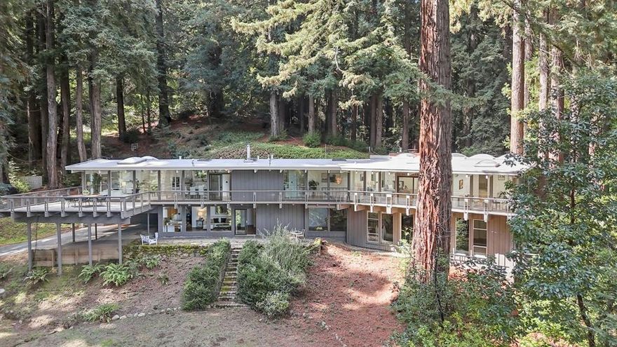 Discover a private architectural gem at 320 Grandview Drive, offering bold design, walls of glass, and sweeping views toward Stanford and the Bay. Nestled on a quiet, private road, the home feels worlds away yet close to everything. The open layout is filled with light and ready for a creative renovation. Inside, a spacious indoor pool and sauna could become a modern wellness retreat, and a large artist studio or workshop provides endless flexibility for work or play. This is a rare chance to transform a striking, light-filled home into a modern estate surrounded by privacy and nature. Within the Portola Valley Elementary School District, this private property offers rare architecture, space, and potential in one of Woodsides most desirable settings. Bring your vision  the potential here is as big as the view.