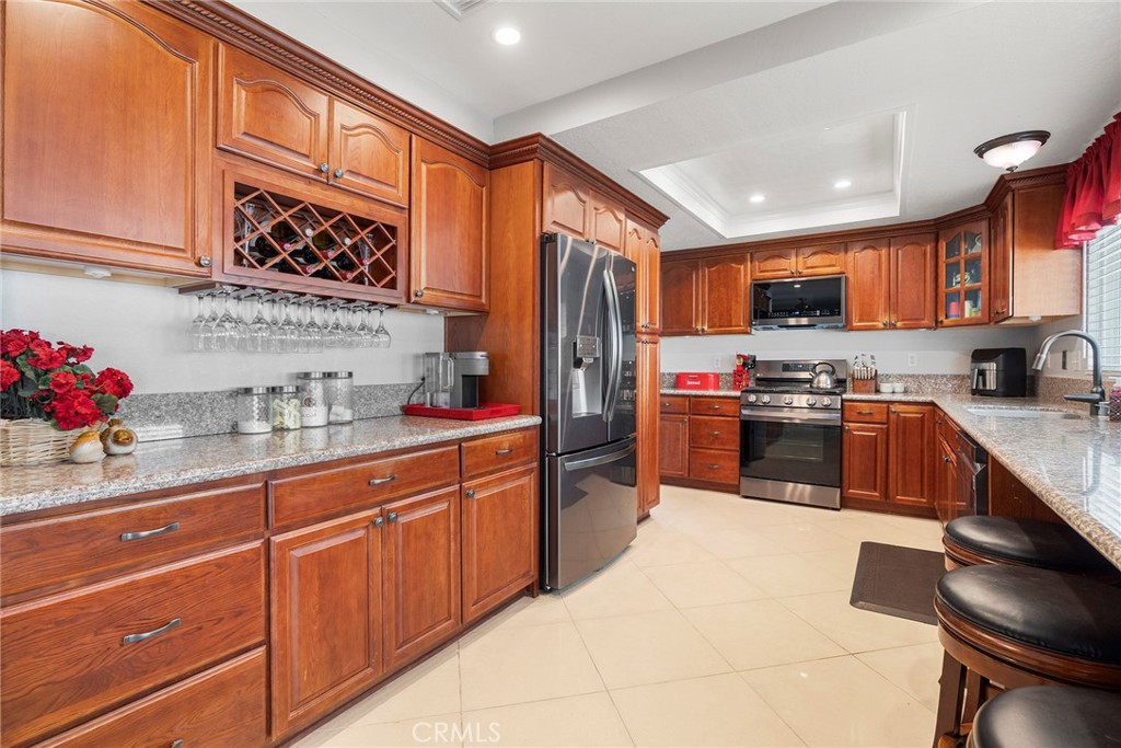 Welcome to 2559 Sandpebble Lane, a charming home in the heart of Brea that combines modern updates with timeless appeal. This spacious 2048 sqft residence offers three generously sized bedrooms, three bathrooms, and a versatile flex space that can adapt to your needs, whether you desire a home office, playroom, or additional living area. As you enter, you are greeted by an inviting atmosphere, enhanced by an abundance of natural light streaming through the updated windows, offering both aesthetic appeal and energy efficiency. The home features a recently updated HVAC system and a newer water heater, ensuring year-round comfort and peace of mind. The three-car garage provides ample space for vehicles, storage, or a workshop, with easy access to the home through the newly renovated wood stairs that lead you up from the garage to the main living area. Inside, the layout offers an open and seamless flow, perfect for entertaining or relaxing with family. The well-appointed kitchen and dining areas provide a warm setting for meals and gatherings, while the expansive living areas offer flexibility for various activities. The living room opens up to a lovely balcony, ideal for enjoying a morning coffee or unwinding in the evening. Just off the kitchen and family room, you’ll find a spacious patio, providing additional outdoor space for dining, relaxation, or entertaining guests. For those seeking a private outdoor retreat, the property is equipped with new vinyl fencing, offering both privacy and low-maintenance enjoyment of the outdoors. With updated features and an ideal location, 2559 Sandpebble Lane provides the perfect blend of modern conveniences and a welcoming environment to call home.