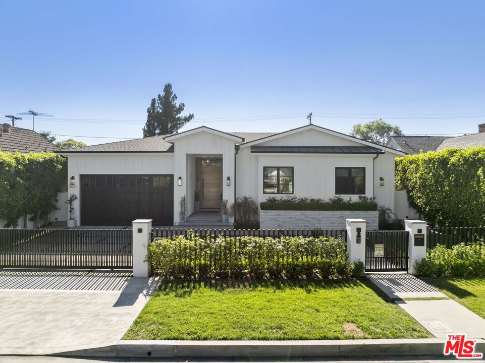 Stunning Traditional located in the sought after Fashion Square neighborhood. Welcome to the home you've been waiting for. An exceptional single-story transitional traditional nestled in the heart of Sherman Oaks. Extensively remodeled in 2019, this 5-bedroom, 5.5-bathroom residence blends luxury and functionality with sophisticated design. Step inside to find soaring 10-foot ceilings, a seamless open floor plan, and expansive suite-style bedrooms. The home is fully equipped with a Control4 Smart Home system, custom finishes throughout, and a striking wine display for the discerning entertainer. The gourmet kitchen is a chef's dream, featuring Vadara Calacatta countertops, a large center island with breakfast bar, top-tier appliances, and bespoke cabinetry. The spacious family room showcases a sleek modern fireplace and dramatic 20-foot glass pocket doors that open onto a spectacular backyard, perfect for entertaining. The primary suite is a retreat unto itself, with vaulted ceilings, dual walk-in closets, and a spa-inspired bath complete with a freestanding tub, oversized shower, and dual vanities. Outside, enjoy a resort-style pool and spa, built-in BBQ kitchen, and a covered patio perfect for al fresco dining or lounging. Additional amenities include an indoor/outdoor surround sound system, HD security cameras, an advanced alarm system, and designer LED lighting throughout. This thoughtfully remodeled residence is truly one of a kind.