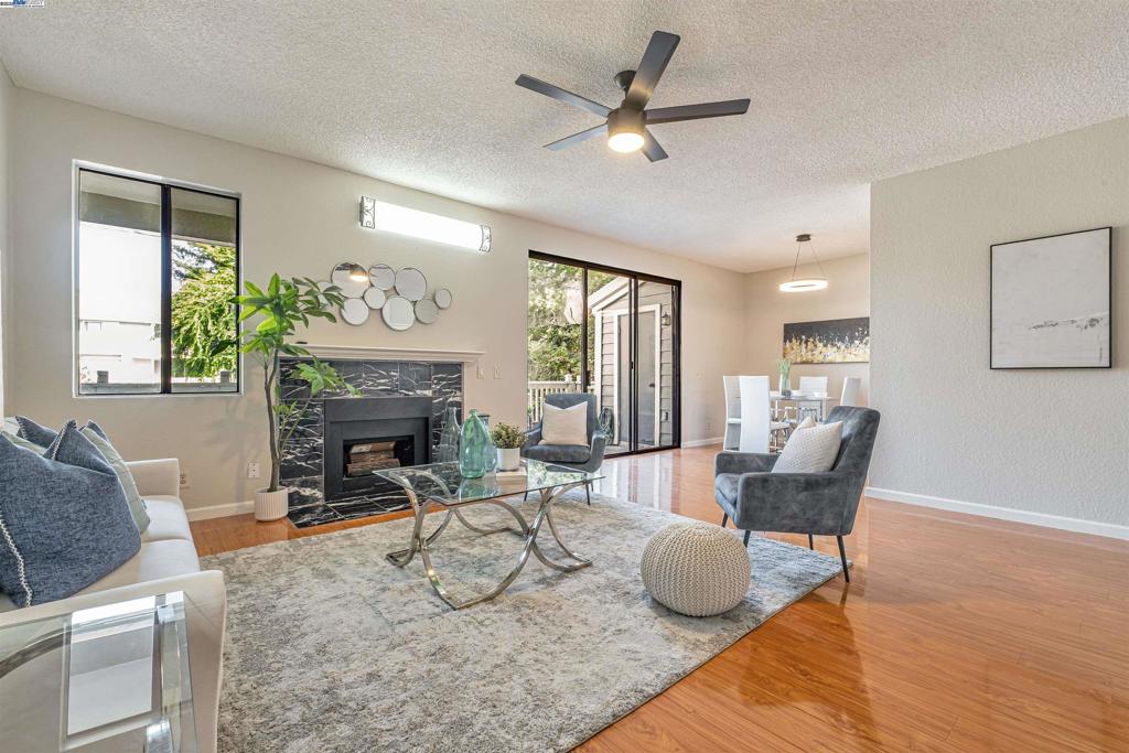 Welcome to this beautiful, move-in ready second-floor end-unit in the desirable Meadowbrook gated community in Central Fremont. Boasting 1,125 sq ft, this is the largest floor plan in the complex and features high ceilings, wood floors, fresh interior paint, and abundant natural light throughout. The spacious primary bedroom includes two closets and a private en suite bathroom with a double-sink vanity. The refreshed kitchen offers a newer fridge and stove, and the convenience of in-unit laundry with washer and dryer included. Step outside to an extended private patio with extra storage — perfect for relaxing or entertaining. This home includes one assigned covered parking space and ample guest parking. Meadowbrook offers resort-style amenities including two swimming pools, hot tubs, BBQ areas, and beautifully maintained grounds. HOA also covers water, hot water, and trash. Ideally located just minutes from Fremont BART, ACE & Amtrak stations, Highways 880, 680, 84, and 92, Dumbarton Bridge, Alameda Creek Trails, Quarry Lakes Regional Park, top-rated schools, shopping, and dining — this condo delivers the ideal combination of space, style, and location. Don’t miss this rare opportunity!