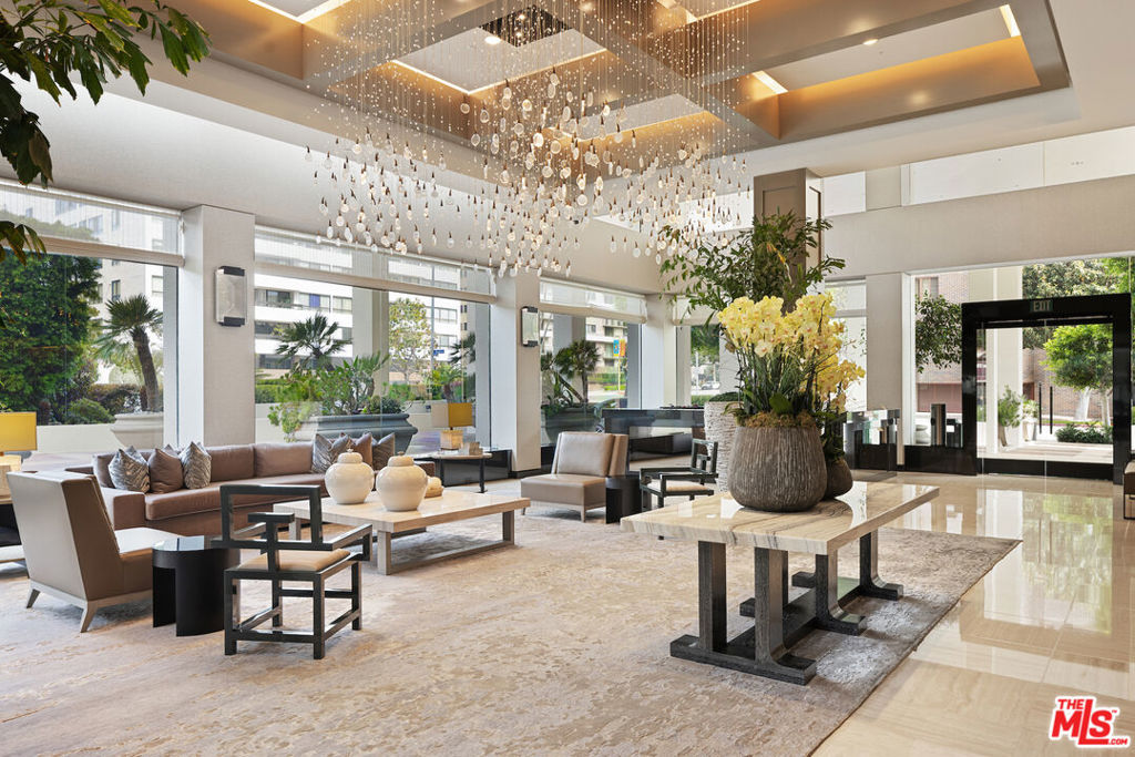 Introducing this South/East facing, 1828 sq ft, 2 Bed, 2.5 Bath, warm and inviting Condominium in the prestigious Ten-Five-Sixty building on the Wilshire Corridor. Well known for exceptional services and amenities, the beautifully renovated Lobby/Lounge area welcomes you home to your quiet retreat away from the busy sounds of the city. Entering through double doors, the recently refreshed kitchen highlights granite counters, new appliances, and wide plank wood floors, color coordinated to the custom cabinet finish. This special corner unit enjoys a spacious living room/open dining area, high ceilings, crown moldings, large windows, a cozy fireplace, and a sliding glass door that leads to one of two balconies that overlook treetops, enchanted by views of the Century City skyline. A large en-suite primary bedroom, with abundant closets, a second balcony and an elegantly appointed bathroom awaits those private times to look forward to. The en-suite second bedroom offers the opportunity to be multi-functional as a guest bedroom, office, or den and features a beautifully appointed, custom-built-in wall complete with desk and shelving storage space in warm wood tones. This exceptional place to call home includes an elegant powder room, a dedicated laundry room with a stackable washer/dryer, and additional storage to make this "home sweet home" complete. Residents of the Ten-Five-Sixty building enjoy 24-hour Valet, Concierge, Fitness Room, Pool, Spa, Social Room (with catering kitchen), EV Charging, two deeded parking spaces, plus additional assigned storage and on-site management. HOA dues include all amenities, water, trash, gas, and basic cable TV. Most conveniently located to shopping, dining, and the busy business district areas of Westwood, Brentwood, Santa Monica, and Beverly Hills. Units in this highly coveted building do not come along often. With security and service in mind, the exceptional staff of the Ten-Five Sixty building are here to meet your everyday needs.