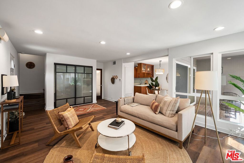 Welcome to 2508 Arizona Avenue, Unit 3, in vibrant Santa Monica. This inviting townhouse, with 1,228 square feet of smartly designed living space, presents an ideal blend of comfort and style. The home features three bedrooms with oak flooring, including a primary suite with a lofted ceiling and an ensuite bathroom for utmost privacy and relaxation. Enjoy the convenience of 2.5 bathrooms, including a downstairs powder room perfect for guests. Step inside to an open-concept living space, leading to a contemporary kitchen with ample storage. The adjoining dining area flows seamlessly to a private outdoor patio, ideal for entertaining or quiet reflection. Amenities include in-unit laundry, finished attic space, a one-car garage, and an additional assigned carport parking space. The interior is newly painted, and the windows are double-paned for quiet and efficiency. Residents will relish the community's resort-style heated pool, picnic area, and pet-friendly policy, with conditions. This corner unit home, situated off the main road, is close to Whole Foods, Trader Joe's, McKinley Elementary School, and Douglas Park. Don't miss the opportunity to make this stylish Santa Monica townhouse your new home, perfectly positioned for lifestyle and convenience.