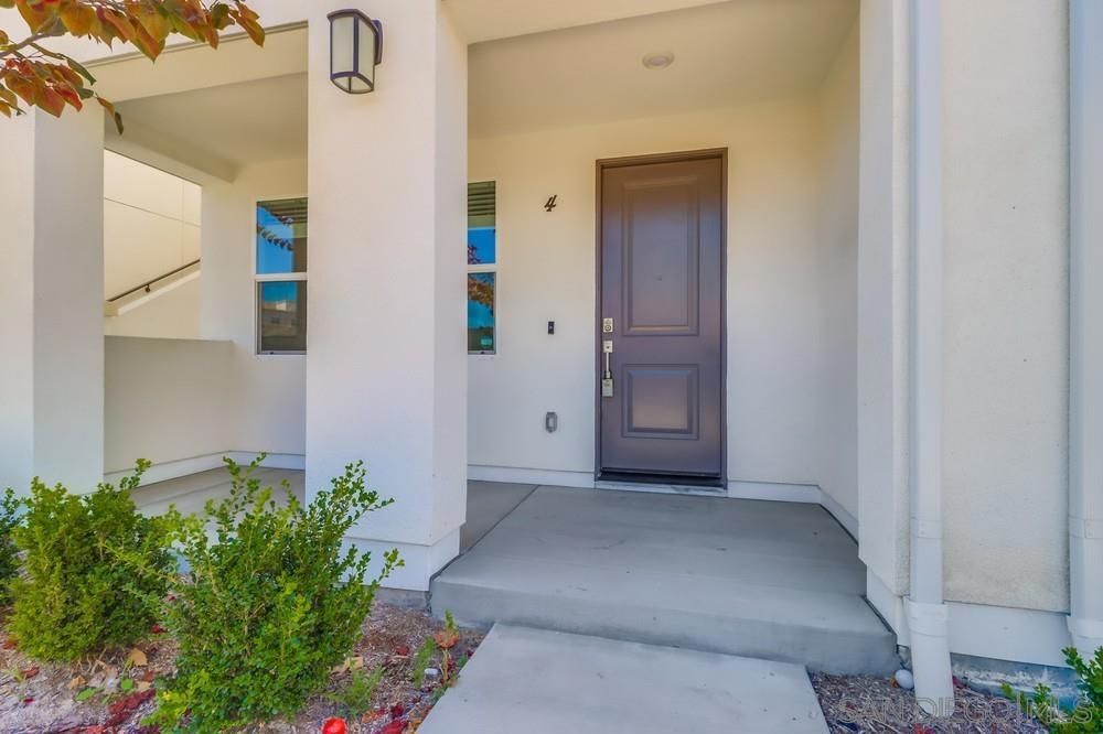 Stop Searching! You’ve Found the ONE! Introducing 1405 Sulu Sea Lane Unit 4 — a stunning modern townhome perfectly designed for family living! Nestled in the heart of Suwerte at Otay Ranch, this 4-bedroom, 4-bathroom gem boasts style and functionality with two private entrances, sleek finishes, multiple balconies, and an abundance of natural light. This TURNKEY residence looks, feels, and even smells like it was built yesterday, featuring solar panels, a water softener, custom built-in cabinets, and stainless-steel appliances—all without extra costs for upgrades! Step outside to embrace resort-style living, featuring tennis courts, a sparkling pool and spa, lush green spaces, and inviting courtyards with built-in barbecues. Invigorating yet minimalist, this lively neighborhood is walkable and boasts everything within reach—from top dining and shopping at Otay Ranch Town Center to nearby transit, top-rated schools, and a charming park just steps from your door. Settled in an area primed for exponential growth, with 13,000 sq. ft of retail space being built less than a mile away! This home offers more than just amenities; it presents a lifestyle tailored for today and tomorrow!