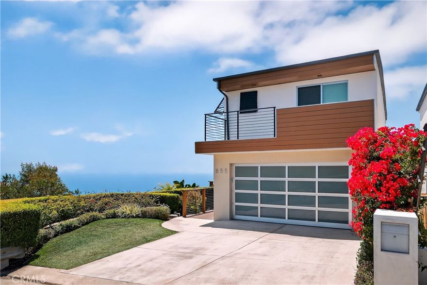 Fully furnished. Open to 6 months, month to month, short term- negotiable. Located at the end of a private cul-de-sac atop Arch Beach Heights, this striking split-level contemporary residence offers unobstructed 180-degree ocean and coastline views, with Catalina Island and twinkling city lights stretching beyond Laguna Beach, visible from nearly every room. Set on an exceptionally rare double-wide lot, the home spans nearly 2,350 square feet and features 4 bedrooms, 3.5 baths, a dedicated office (optional 4th bedroom), a private theater, and a custom wine room. Originally reimagined in 2007 by acclaimed designers Anders Lasater and Mark Singer, the home blends bold design with timeless quality. The spacious primary suite includes a custom-built closet system and an expansive spa-like bathroom complete with a steam shower, soaking tub, and a built-in TV for the ultimate retreat. Upstairs, the main living area boasts an open-concept layout with hardwood and stone flooring, a chef’s kitchen with stainless steel appliances—including a Bosch ultra-quiet dishwasher—cherry wood cabinetry, granite counters, skylights, a breakfast bar with a mini-fridge, and a center island cooktop. Sliding doors lead to both front and rear decks, seamlessly extending the living space outdoors. This exceptional property offers the rare combination of architectural sophistication, functional design, and breathtaking natural beauty. Just moments from world-class beaches, hiking trails, restaurants, and vibrant village life, this home is not only a peaceful retreat but also a gateway to the very best of coastal living. Whether you're entertaining guests or enjoying a quiet evening overlooking the Pacific, this one-of-a-kind residence delivers an unparalleled lifestyle experience.