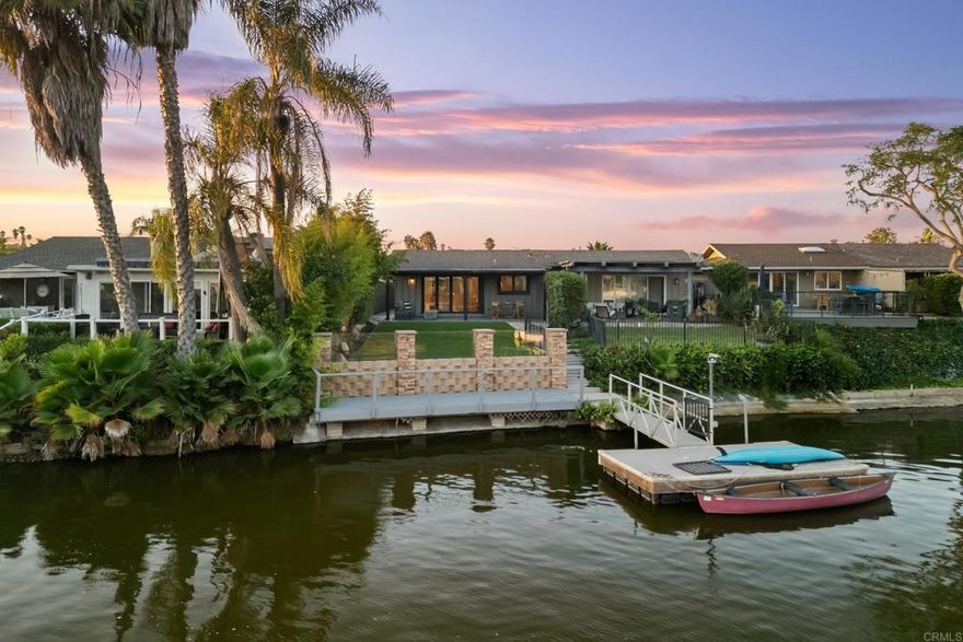 Live lakeside luxury every day in this breathtakingly remodeled Lake San Marcos home. This 3-bedroom, 2-bath retreat is where modern design meets relaxed waterfront living. Just outside your backyard, a private shared boat dock with sitting area invites morning paddles, afternoon fishing, or sunset cruises right from home. Unlike many lakeside properties, this one offers its own usable backyard — a rare bonus perfect for entertaining, dining under the stars, or simply unwinding by the water. Inside, no detail has been overlooked. The open-concept design features a chef’s kitchen with quartz countertops, sleek stainless appliances, and designer finishes. Expansive breakaway doors blur the line between indoors and outdoors, filling the home with natural light and framing tranquil lake views. The primary suite is a spa-like haven with a freestanding tub and luxurious en suite bath, creating the ultimate space to recharge. With its lakeside dock, private backyard, and showpiece remodel, this home is truly one of Lake San Marcos’ finest offerings.