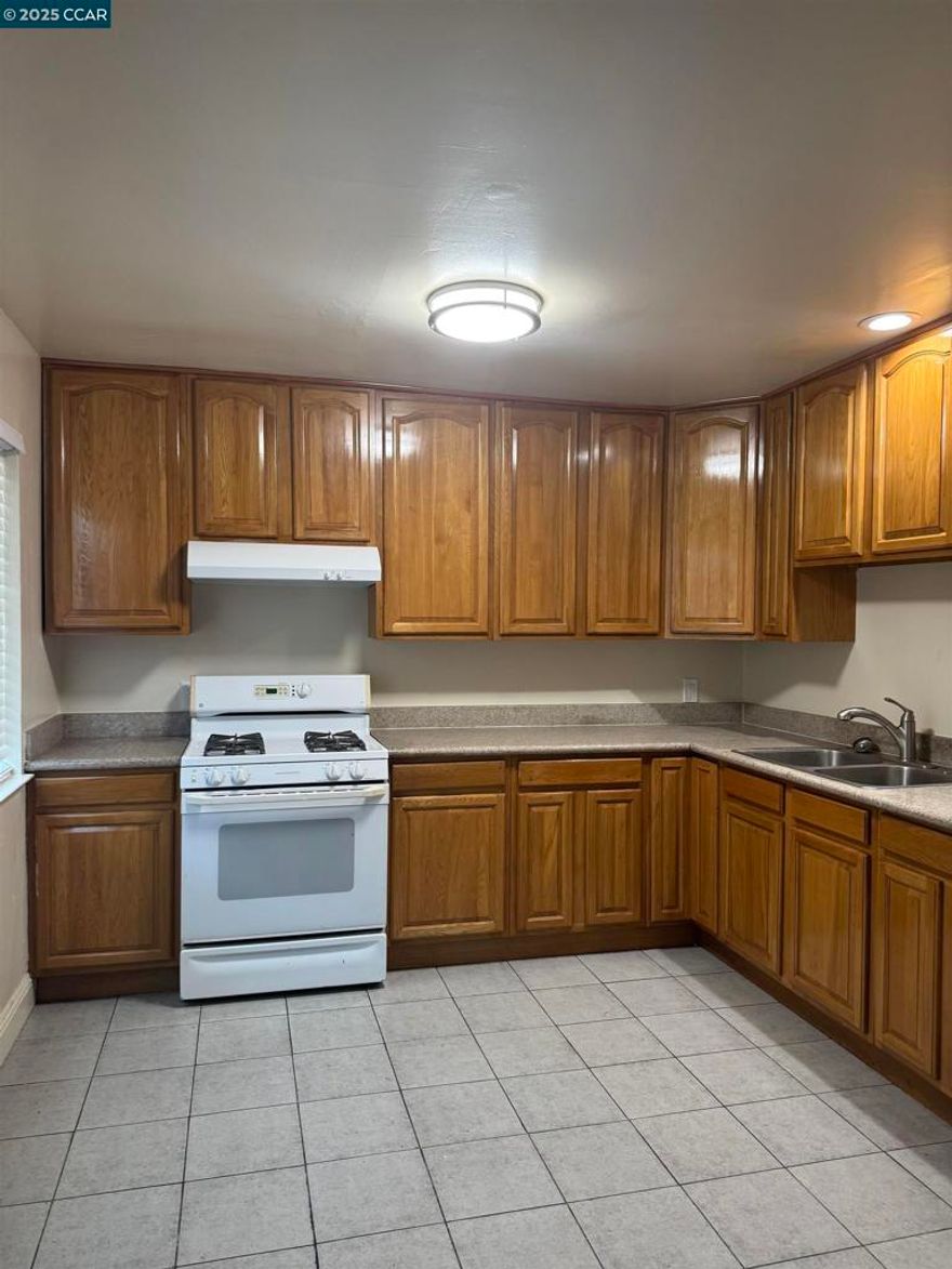 Close to freeways , shops restaurants second level walk up stairs to apartment all one level apartment borderline Emeryville . Spacious  two bedroom with mirrored closet doors and new lament flooring.  Bathtub with shower  wood cabinets in bathroom. Rent  includes garbage and water . Kitchen includes refrigerator, stove , microwave. Living room has easy t clean  laminate flooring. Ready to move in comes with blinds on all windows and security door. nice natural light . ready for occupancy. use rent spree for credit ck , listing agent to write rental agreements. Apply with RentSpree https://apply.link/0BZHIC8 make offer rent negotiable . section 8 ok , all forms of rent subsidy accepted.
