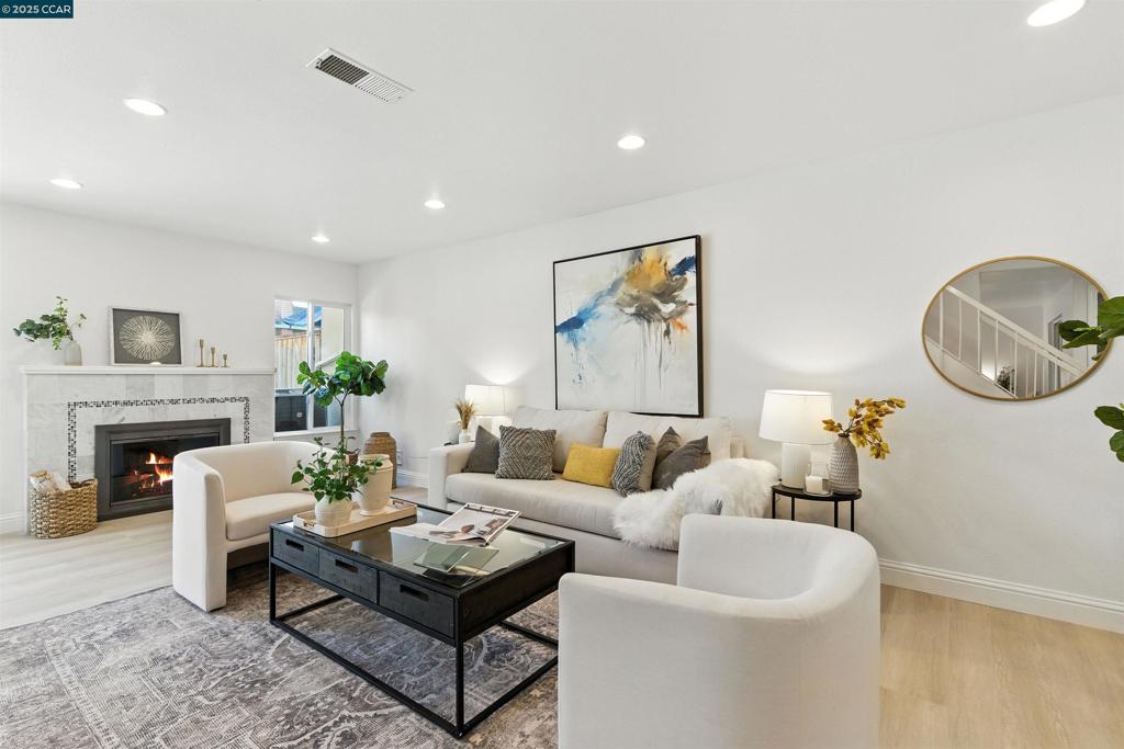 Welcome to spacious and move-in ready 4-bedroom, 2.5-bathroom townhome offering 1915 sq ft of thoughtful designed light-filled living room with cozy fireplace, sliding glass doors and serene views of the private courtyard. Step inside to an open floor plan featuring new flooring, fresh interior paint, and large dual-panel windows. The remodeled kitchen is a chef's dream with quartz countertops, modern cabinetry, stainless steel appliances, elegant backsplash, and brand new LED lights. Primary suite offers a relaxing retreat with a walk-in closet, mountain views, and a spa-like ensuite bath with jetted tub. On the upstairs also have three additional bedrooms provide flexibility for family, guests, or a home office. Central heat & AC, in-unit laundry, and an attached 2-car garage, also have many fruit trees and flowers. Located in a quiet cul-de-sac, as a resident of Heather Farms, you will have access to resort-style amenities including swimming pools, tennis courts, clubhouse, and scenic walking trails. The location can not be beat-close to Heather Farm Park, Diablo Hills Golf Course, Top-rated schools, shopping, dining, and BART. What its perfect blend of modern updates, community amenities, and an unbeatable location, this townhouse is ready to welcome your home.