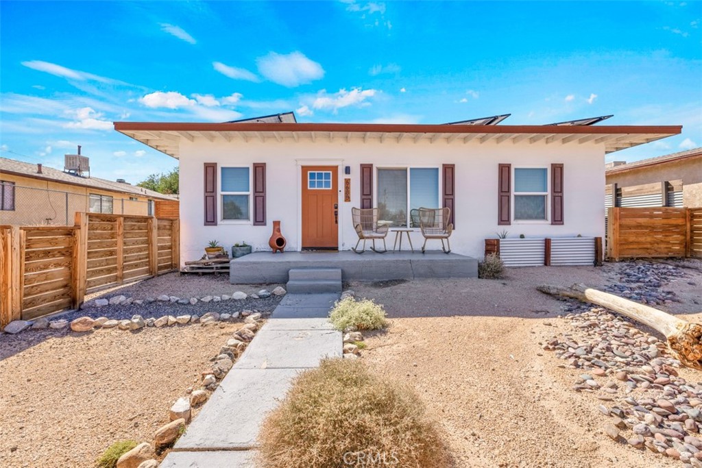 Welcome to this exceptional turnkey investment opportunity that seamlessly blends modern comfort with desert charm. This beautifully updated two-bedroom, one-bathroom home spans approximately 1,000 square feet and has established itself as a highly successful short-term rental over the past four years, making it perfect for investors seeking immediate income potential or buyers looking for their own desert retreat. Every inch of this property has been thoughtfully renovated with complete interior and exterior updates that create a fresh, contemporary feel while maintaining the authentic character that guests love. The home features energy-efficient solar panels that significantly reduce operating costs, making it both environmentally conscious and economically smart for long-term ownership. The backyard transforms this property into a true oasis, featuring a relaxing spa where guests can unwind under the star-filled desert sky and various entertainment options that keep visitors engaged and coming back year after year. Whether you're continuing the successful rental business or claiming this gem as your personal escape, the outdoor space provides the perfect setting for desert living at its finest. Location is everything, and this property delivers on all fronts. Situated close to downtown Twenty-nine Palms, you'll have easy access to local dining, shopping, and services. Adventure seekers will appreciate the quick drive to Joshua Tree National Park's north entrance, while the proximity to Twenty-nine Palms Marine Base ensures a steady stream of potential guests. This prime positioning makes the property attractive to a diverse range of visitors, from military families to outdoor enthusiasts exploring one of California's most beloved national parks. This turnkey opportunity offers the rare combination of proven rental success, modern amenities, and an unbeatable location that continues to attract guests season after season.
