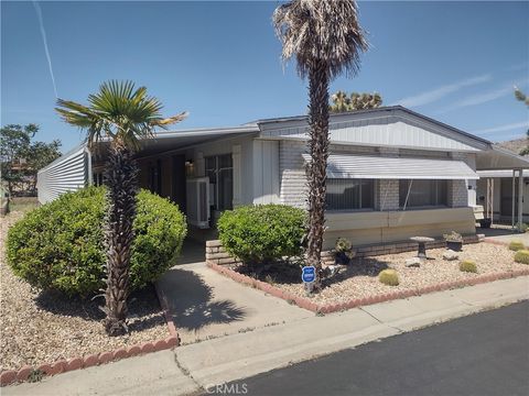 Photo of 7501 Palm Avenue #114, Yucca Valley, CA 92284 (MLS # HD26076630)