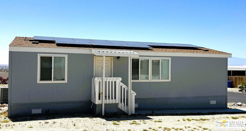 Welcome to the beautiful community of Palm View Estates! This newer home features just under 1000 SF and comes complete with SOLAR! Sellers have had no electric bills. Ask listing agent for details. There are 3 bedrooms and 2 baths with laminate flooring throughout for easy cleaning. Appliances include gas range, refrigerator and dishwasher. There is a carport off the kitchen for 2 cars plus there is room on the other side of the home for additional parking. This family park is very quiet and features a beautiful Clubhouse with pool, spa and playground area. Security entrance gate is open 6AM to 6PM then locked for security. Gate clicker or keypad access needed after that. Call today to set up an appointment to view this great home!