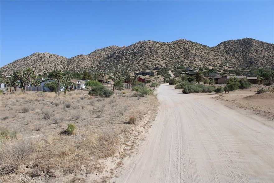 Amazing 54,885 square foot / 1.26 Acre flat lot perched on a peaceful hill looking over Pioneertown! This prime location allows you to hop over to Pappy and Harriet's and see a concert or grab dinner! If you are looking to Visit Joshua Tree, the park entrance is only a 20 minute drive. A wondeful location to build your dream home, Ranch, airbnb, compound, etc... this lot offers everything you need for a peaceful home, the possibilities are endless!!
Adjacent parcel is also for sale, buy both for a combined 2.52 Acre lot!
(located right across from 5388 Minna Gombell Ln, Pioneertown Ca 92668 )