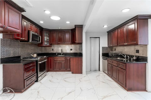 Photo of 6340 Wilbur Avenue, Tarzana, CA 91335 (MLS # BB26219716)