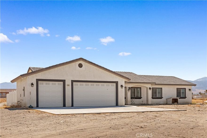 Welcome to this remarkable 2.2± acre horse property in Pinon Hills, offering a peaceful retreat with stunning views of wildlife and snowcapped mountains. This home features a tile roof and a spacious 3-car garage with 8-foot doors, complemented by numerous upgrades.The impressive open floor plan showcases large tile wood-looking floors, a tray ceiling, LED lighting, and tall baseboards. The gourmet kitchen features a huge island, marble countertops, stainless steel appliances, and a beautiful backsplash.This residence includes 4 bedrooms, 2 full bathrooms, and a half bath. Enjoy the convenience of a separate laundry room with quartz counters. The master bathroom is a standout, with dual sinks and a luxurious tile/glass shower with dual shower heads.Additional highlights include a tankless water heater and the property’s location in the award-winning Snowline School District. Experience the tranquility and elegance of this exceptional property!