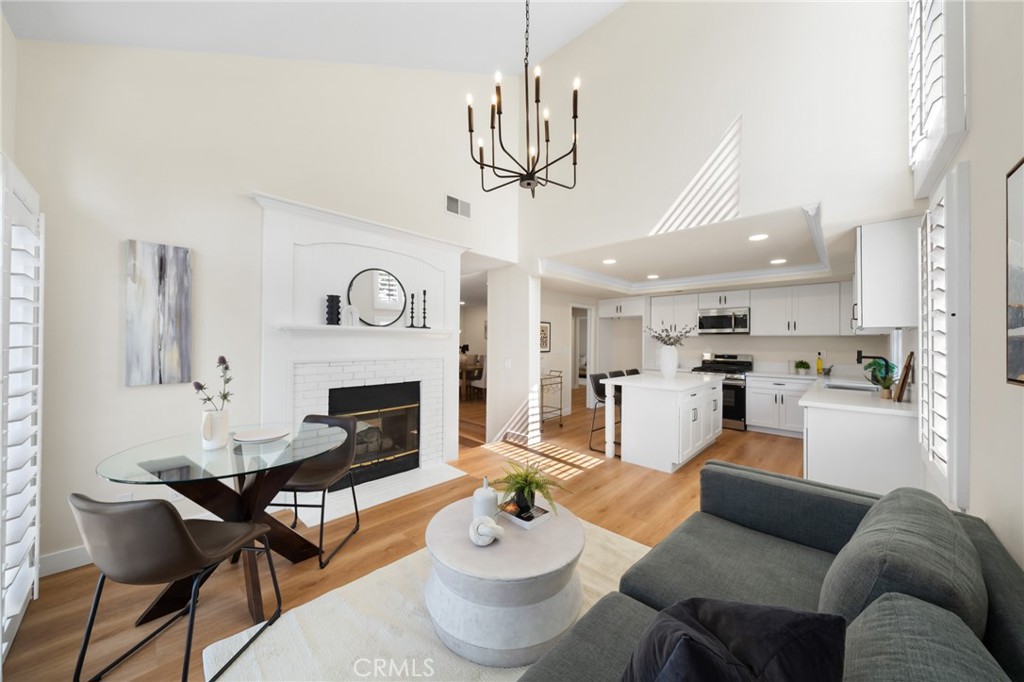 Exquisitely Remodeled End-Unit Townhome in Coveted Bixby Village
Perfectly situated in a prime interior location, this stunning end-unit townhome blends timeless elegance with modern luxury. Bathed in abundant natural light, the thoughtfully designed floor plan showcases an impressive array of upgrades throughout.
The heart of the home is a beautifully remodeled kitchen, complete with crisp white shaker cabinetry, gleaming countertops, and brand-new, state-of-the-art appliances. An expansive formal dining room overlooks the sunken living room, where a striking dual-sided fireplace creates a warm, inviting ambiance between the living area and the cozy den.
On the first floor, you’ll also find a gorgeously updated full bath with a walk-in shower and a generous office—easily adaptable as a fourth bedroom or family room. Both the living room and den feature sliding glass doors that open to a spacious private patio, perfect for outdoor entertaining or peaceful relaxation.
Ascending to the upper level, vaulted ceilings and streaming sunlight create an airy, open feel. Three spacious bedrooms and two fully remodeled bathrooms await, including the luxurious primary suite. The spa-inspired primary bath boasts a massive walk-in shower, a deep soaking tub, and dual vanities with expansive counter space. The primary bedroom itself offers exceptional space and abundant closets for all your storage needs.
Bixby Village’s location is second to none—just minutes from the boutiques, dining, and vibrant atmosphere of PCH & 2nd Street and Belmont Shore. This home offers the perfect blend of comfort, style, and convenience in one of the area’s most sought-after communities.