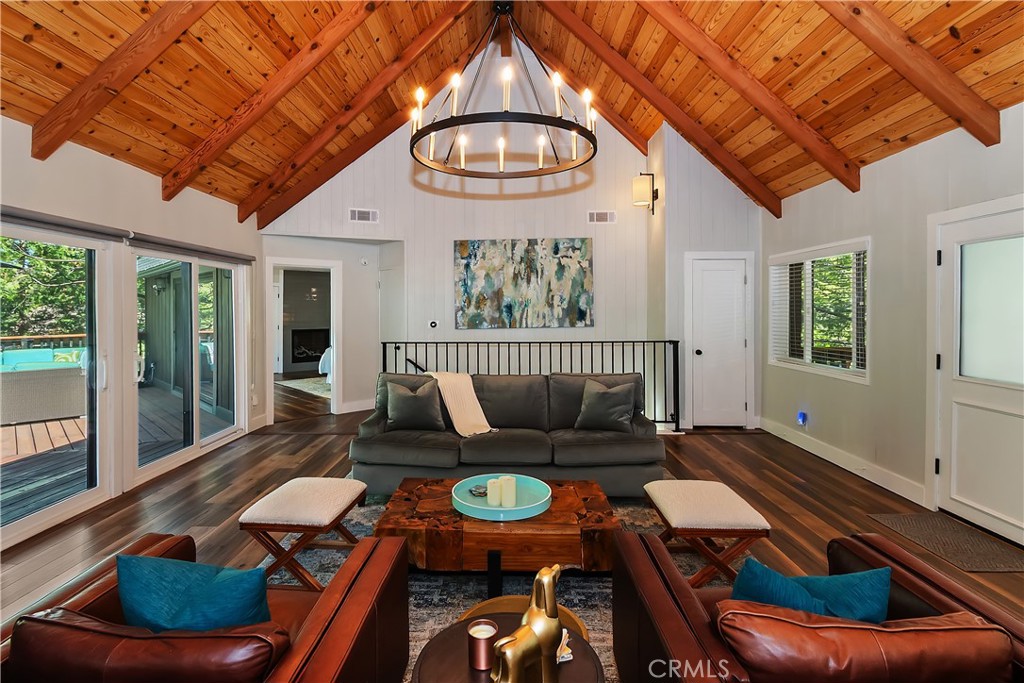Experience the perfect balance of mountain charm and modern living at 853 Golf Course Road. Just moments from the country club, 18 holes of golf, private tennis and pickleball courts, and Grass Valley Park, this home places you at the heart of the mountain lifestyle.
Set on an expansive lot with soaring trees and dramatic boulders, the setting is pure mountain magic. A level driveway flows directly into the attached two-car garage, while a welcoming covered porch and double-door entry create a warm first impression.
Inside, the open-concept design invites gatherings—whether around the fireplace in the living room, cooking in the chef’s kitchen with its high-end LG appliances, wine refrigerator, and oversized island, or stepping outside to the expansive deck to entertain.
The main-level primary suite feels like a private retreat, complete with a spa-like ensuite bath and direct access to the deck. Downstairs, a large bonus room, two additional bedrooms, and a second deck offer the perfect space for guests, recreation, or quiet relaxation.
From summer evenings on the deck to cozy winter nights by the fire, 853 Golf Course Road is more than a home—it’s a year-round mountain sanctuary.
