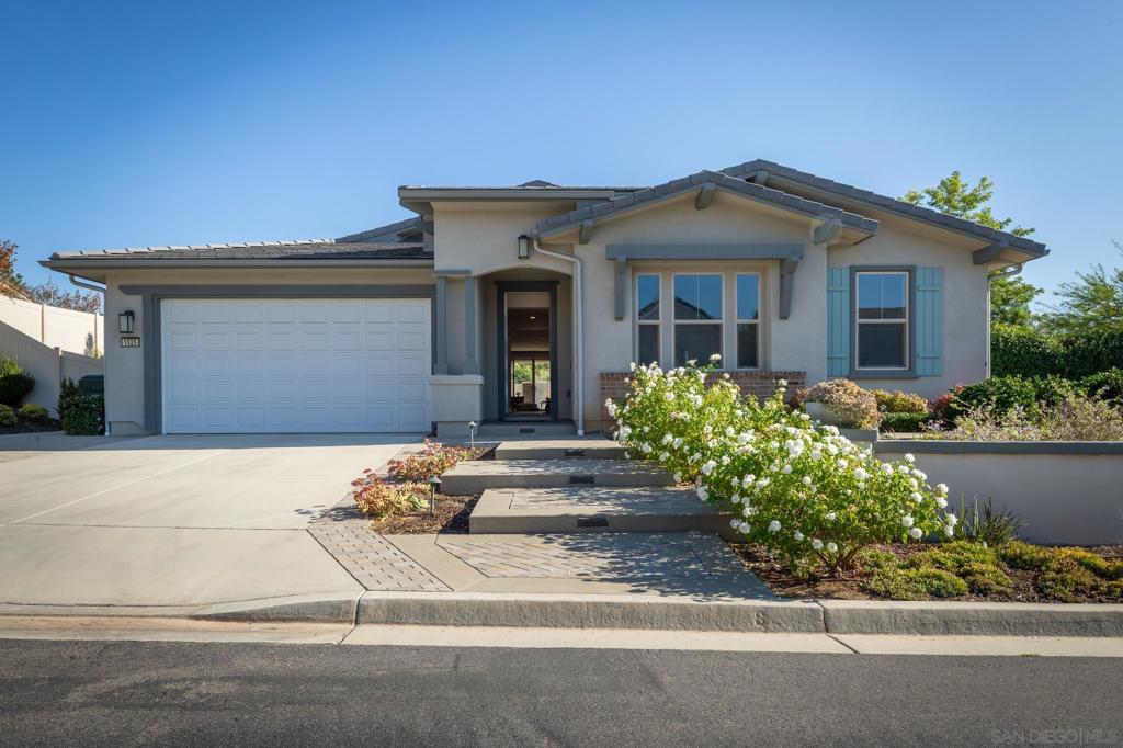Gorgeous single-level home in the sought-after gated Oak Creek community of 24 residences. Nestled among Vista's scenic hills, this home offers an open layout. Upgraded flooring throughout. Solar. Great room flows into a serene backyard retreat. Fireplace. Features 4 spacious bedrooms and plus office, walk-in closets, and a designer kitchen with large island. The yard boasts a built-in fire pit with seating, professional landscape and a Built-in BBQ perfect for entertaining. A must-see property! No Mello Roos, Low HOA.