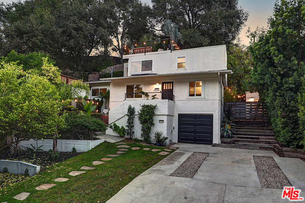 3 bedrooms + 3 Bathrooms + Office + Workout/Massage Room | Perched in the heart of coveted lower Laurel Canyon, this stunning entertainer's dreamseamlessly blends indoor-outdoor living with breathtaking panoramic canyon views. From the moment you arrive, this beautifully styled residence invites you into thequintessential California lifestyle you've been dreaming of. Step inside to discover a sun-drenched living room where skylights bathe gleaming hardwood floors in naturallight beneath soaring ceilings that create an airy, expansive feel. The open kitchen flows effortlessly from the living spaces and showcases stainless-steel appliances,elegant stone countertops, and a welcoming breakfast bar perfect for morning coffee or casual gatherings with friends. The ground level thoughtfully houses twocomfortable bedrooms, a convenient powder room, and an additional bathroom featuring a charming original 1924 clawfoot tub, a treasured piece of history preserved withcare. Ascend to your private primary suite with airy canyon views. Walls of windows and doors frame lush canyon landscapes and flood the space with natural light, whilethe spa-like ensuite bathroom pampers with stone counters, dual sinks, and a step-in shower. From both levels of the home, step directly into your lush backyard oasisdotted with fruit-bearing trees, and avacado tree and multiple intimate terrace areas perfect for sunset gatherings. A generous lot size with an abundance of square footageavailable for those looking to possibly expand the property now or in the future. Soak in sweeping canyon vistas from the comfort of your private hot tub, or host intimatesunset cocktails on the spacious rooftop deck where the views become your most impressive guest. For larger celebrations, the expansive lower terrace offers abundantspace for both dining and lounging your new favorite venue for unforgettable gatherings under the California sky. Whether hosting dinner parties, weekend barbecues, orcasual get-togethers, this home offers multiple beautiful backdrops for every occasion. Modern conveniences enhance the Canyon charm, including a detatched privateoffice or studio space that supports today's work-from-home lifestyle. The one-car garage comes equipped with an EV charger, and abundant on-site parking a true rarity inLaurel Canyon ensures your guests will always have a place to park. Located within the highly desirable Wonderland school district and offering easy access from LaurelCanyon Boulevard to Kirkwood Drive, then right onto Ridpath (house on the left side), this residence provides both tranquility and convenience.This turnkey home's beautifulfurnishings and sophisticated styling are available for separate purchase, allowing you to move in and start living your best Canyon life immediately. At this price point,nothing in Laurel Canyon compares. This is more than a home, it's a lifestyle waiting to be lived. Property also holds an approved license to be used as an Airbnb forshort or long term rentals. Property is also listed for sale. Property can be leased with furniture for $8,750 per month and $8,750 deposit.