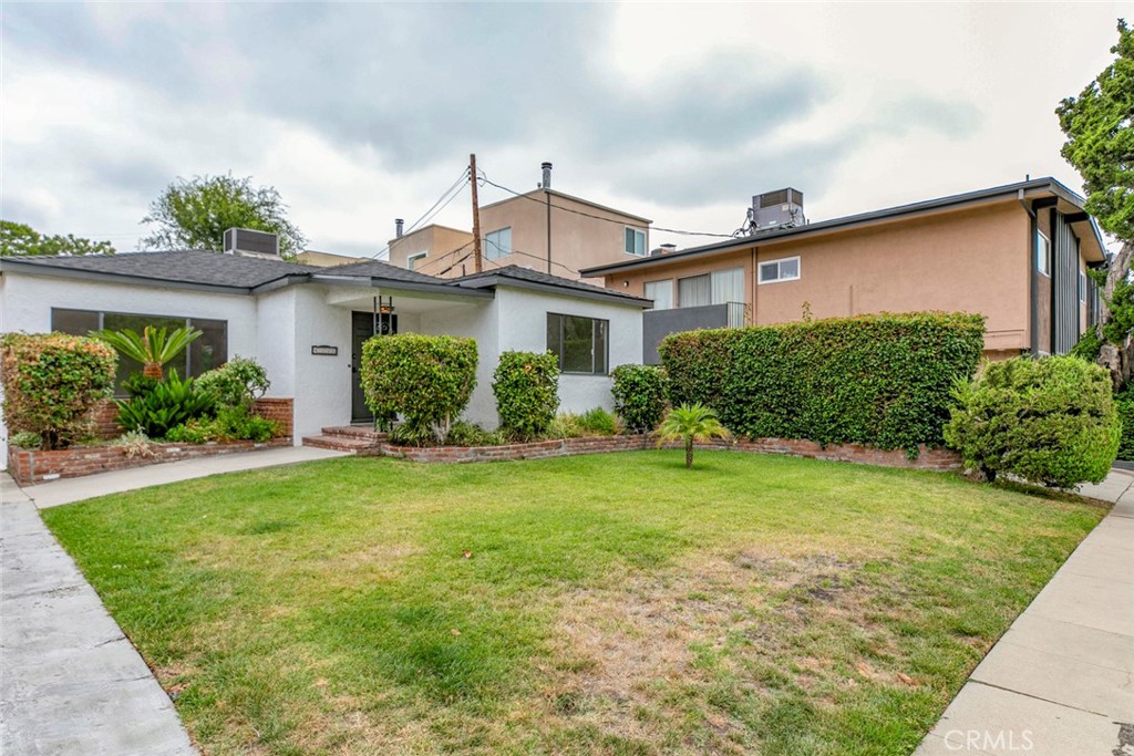 Welcome to this beautifully updated single-family home located in the heart of Sherman Oaks! Offering 3 spacious bedrooms and 2 full bathrooms across 1,253 square feet of bright, open living space, this residence combines comfort and modern style. Step into a light-filled living room with large picture windows and recessed lighting, creating a warm and inviting atmosphere. The updated kitchen features sleek black cabinetry, stainless steel appliances, a center island, and plenty of storage—perfect for cooking and entertaining. The bedrooms are airy with mirrored closets and vaulted ceilings, while the bathrooms are refreshed with modern fixtures and a clean, stylish design. Enjoy the convenience of in-unit laundry with a stacked washer and dryer. Outside, you’ll find a private and well-maintained front lawn, a tiled patio space for relaxing or entertaining, and lush greenery providing extra privacy. Street parking only. Situated near shopping, dining, and easy freeway access, this home offers both convenience and tranquility in one of the Valley’s most sought-after neighborhoods. Available Now! Don’t miss this gem in Sherman Oaks. Landlord will be building ADU.