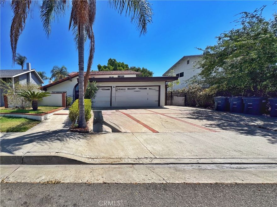 Welcome to this bright and beautifully updated 5-bedroom, 3-bath residence nestled in a peaceful, established neighborhood of Orange. Boasting over 2,200 sq ft of elegant living space, it features a grand double-door entry with soaring cathedral ceilings, a welcoming living room with fireplace, and a formal dining room perfect for gatherings. The home has been thoughtfully upgraded with fresh paint, durable laminate wood and tile flooring, modern cabinetry, stainless appliances, and luxurious granite countertops in both the kitchen and bathrooms.



On the main level, two bedrooms and a full bath offer flexibility for guests or work-from-home needs. The updated in-house laundry area offers seamless access to a spacious three-car garage for your convenience. Outside, enjoy a generous backyard with two covered patios—ideal for entertaining or unwinding—and RV parking on the side for additional vehicle or storage needs. Wake up to breathtaking views of the Orange Hills from the backyard and select upstairs bedrooms.



With centralized AC/gas heating, and proximity to Supermarkets such as Albertsons, restaurants, freeways, top-rated schools (including El Modena High School), Chapman University and Santiago Canyon College, this home is a perfect blend of comfort, style, and convenience. Available for rent—don’t miss this gem in Orange!