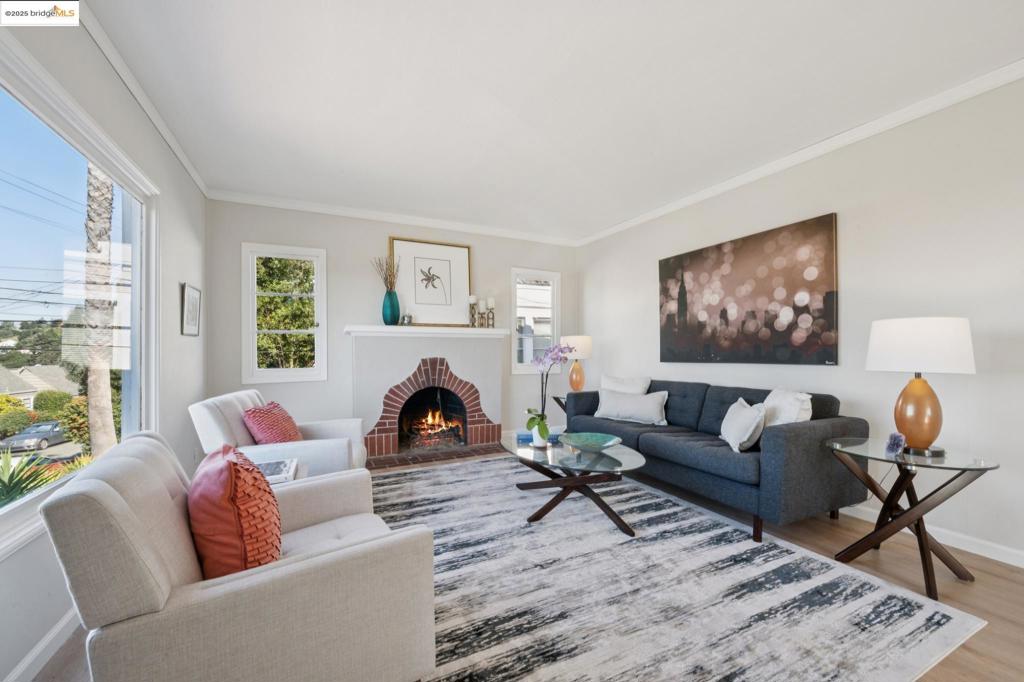 Bright and airy with exquisite light, this two bedroom, one bath Redwood Heights charmer sits above the street and offers classic character and a wonderful sense of space. New light flooring runs through the living and dining rooms, into the original kitchen and through the laundry room, providing a seamles flow between the spaces. The newly carpeted bedrooms and remodeled bath are set apart from the public rooms by a short hallway. Beyond the kitchen is a terrific family room that opens directly onto the private backyard - the perfect place for relaxing, entertaining, gardening or indoor-outdoor living. Interior access from the kitchen to the one plus-car garage and basement offers great convenience and tons of storage. Located on a super friendly street with substantially larger properties, this welcoming home is a great opportunity to step into the many amenities Redwood Heights has to offer.