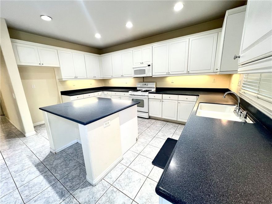 Welcome to this spacious 5-bedroom, 4-bath home located in the wonderful community of Canyon Hills! With plenty of room for everyone, perfect for families who love to relax, entertain, and enjoy the best of Southern California living. Bright and open layout, featuring a formal living room and a separate family room with a cozy fireplace. The kitchen is the heart of the home, with a large center island, plenty of counter space, Corian countertops, and built-in appliances — perfect for cooking and gathering together.
 There’s also a bedroom and full bath downstairs, great for guests or extended family.  Upstairs, has a spacious master suite with its own private bathroom featuring dual sinks, a soaking tub, a separate shower, and a walk-in closet
Enjoy the convenience of an indoor laundry room with a sink and cabinets, plus a three-car garage for extra storage.
Step outside to your very own backyard oasis complete with a private swimming pool — perfect for summer fun and weekend barbecues!
Located close to top-rated schools, beautiful parks, and community amenities, this Canyon Hills home offers the perfect blend of comfort, space, and family-friendly living.