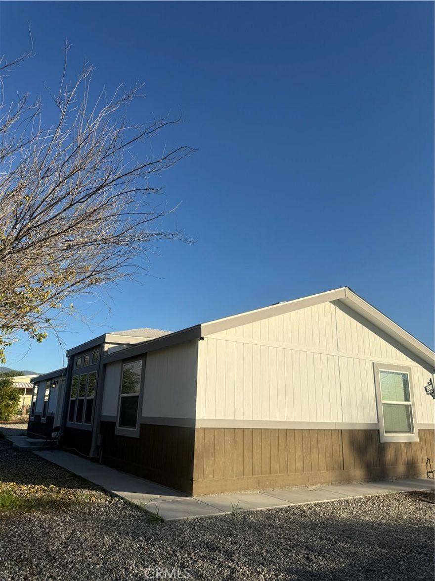 Beautiful 2023 single-story home with a modern open-concept layout that brings the living room and kitchen together—perfect for everyday living and entertaining. The kitchen features stainless steel appliances and a spacious island for meal prep or gatherings. The primary suite offers a private bathroom and walk-in closet, while two additional bedrooms share a full hallway bath. Enjoy the convenience of indoor laundry, built-in window blinds, and central A/C. Sitting on a large 9,148 sq ft lot, the low-maintenance, water-conserving yard is designed with cement, stone, mulch, and select plants, providing plenty of usable outdoor space. An excellent opportunity for homeowners or investors looking for a newer property with long-term potential.