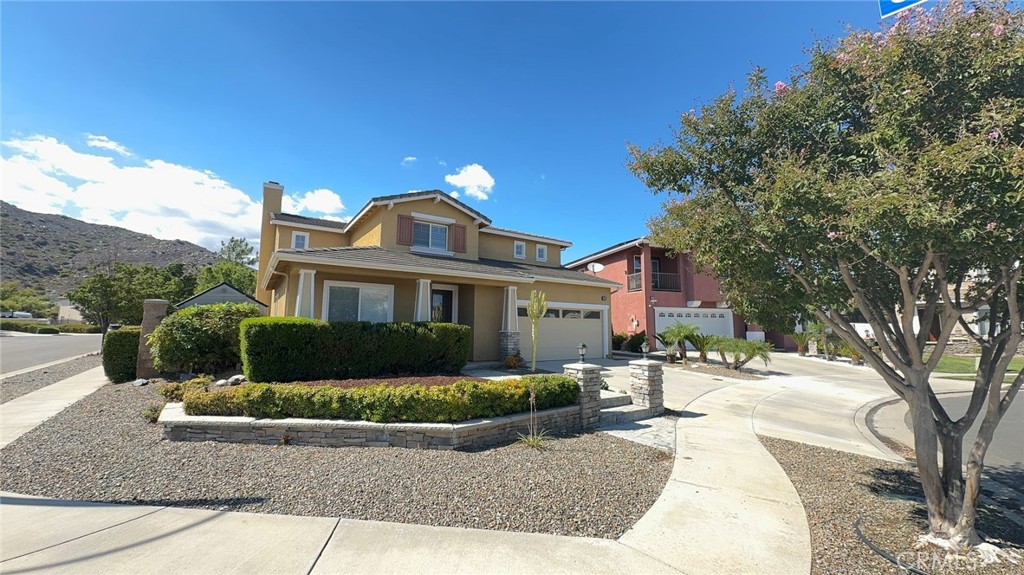 Beautiful Copper Canyon Home with Dual Master Suites! Welcome to this stunning Copper Canyon home in Murrieta, perfectly designed for comfort, space, and style! Highlights: Two Master Suites: Main Floor: Private suite with its own entrance, slider to the backyard, oversized soaking tub, separate shower, custom cabinetry, and walk-in closet with organizer. Upstairs: Second master suite featuring breathtaking mountain views. Spacious Layout: 3 additional large bedrooms plus an oversized storage/craft room. Bright Gourmet Kitchen: Granite counters, large center island, double ovens, cooktop, microwave, walk-in pantry, and a sunny breakfast nook. Main Floor Office/Bonus Room: Complete with built-in cabinetry, perfect for working from home or extra living space. Upgraded Interiors: Hardwood floors, plush carpet, crown molding, ceiling fans, and custom paint throughout.
Entertainer’s Backyard: Low-maintenance landscaping with a built-in BBQ, all set on a desirable corner lot at the end of a cul-de-sac!
