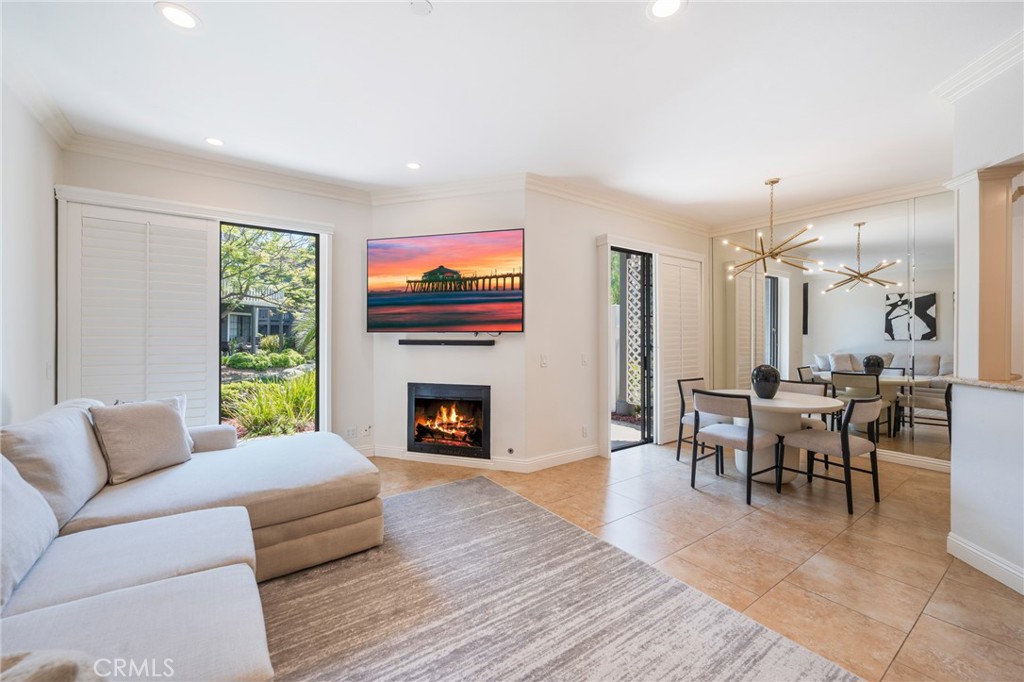 WHEN ONLY THE BEST WILL DO ! PRIME VIEWS OF THE LARGE LAGOON AND WATERFALLS ! NUMBER 1 LOCATION IN SEABRIDGE VILLAGE - PRIVATE ENTRY SURROUNDED BY MATURE TREES AND LANDSCAPING - FULLY UPGRADED AND CUSTOM THRU OUT - PRISTINE CONDITION - VERY OPEN FLOORPLAN - ENDLESS NATURAL LIGHT - HIGHEND REMODELED KITCHEN WITH CUSTOM CUTOUTS AND CUSTOM BEAMS REALLY SHOW OFF THE ACCENTS, BEAUTIFUL GRANITE, STAINLESS STEEL APPLIANCES, HARDWARE AND STUNNING BACKSPLASH - LUXURY PLANK FLOORING AND BEAUTIFUL TILE THRU OUT - BEAUTIFUL TOP QUALITY LIGHTING - SHUTTERS THRU OUT - 2 LARGE BEDROOMS - BOTH BATHROOMS ARE COMPLETELY REMODELED WITH THE MASTER BATHROOM BEING THE ONLY CONDO WITH A SEPARATE SHOWER AND TUB, LARGE PATIO IS PERFECT TO HAVE GATHERINGS, PARTIES, OR JUST LAYING OUT FOR THE PERFECT CALIFORNIA BEACH TAN, ALL WHILE ENJOYING A PRIME VIEW ! TRULY A MUST SEE ! ALL UPGRADES ARE TRUE QUALITY AND GORGEOUS ! 1 CAR GARAGE PLUS A DRIVEWAY ! ENDLESS ADDITIONAL PARKING ON THIS STREET - SEABRIDGE IS A GATED COMMUNITY WITH POOLS, JACUZZI'S, TENNIS COURTS, AND A LARGE PARK ! JUST DOWN THE STREET FROM THE BEACH, MAIN STREET, HUNTINGTON BEACH PIER, AMAZING SHOPPING AND RESTAUANTS - LIFE IS BEAUTIFUL !