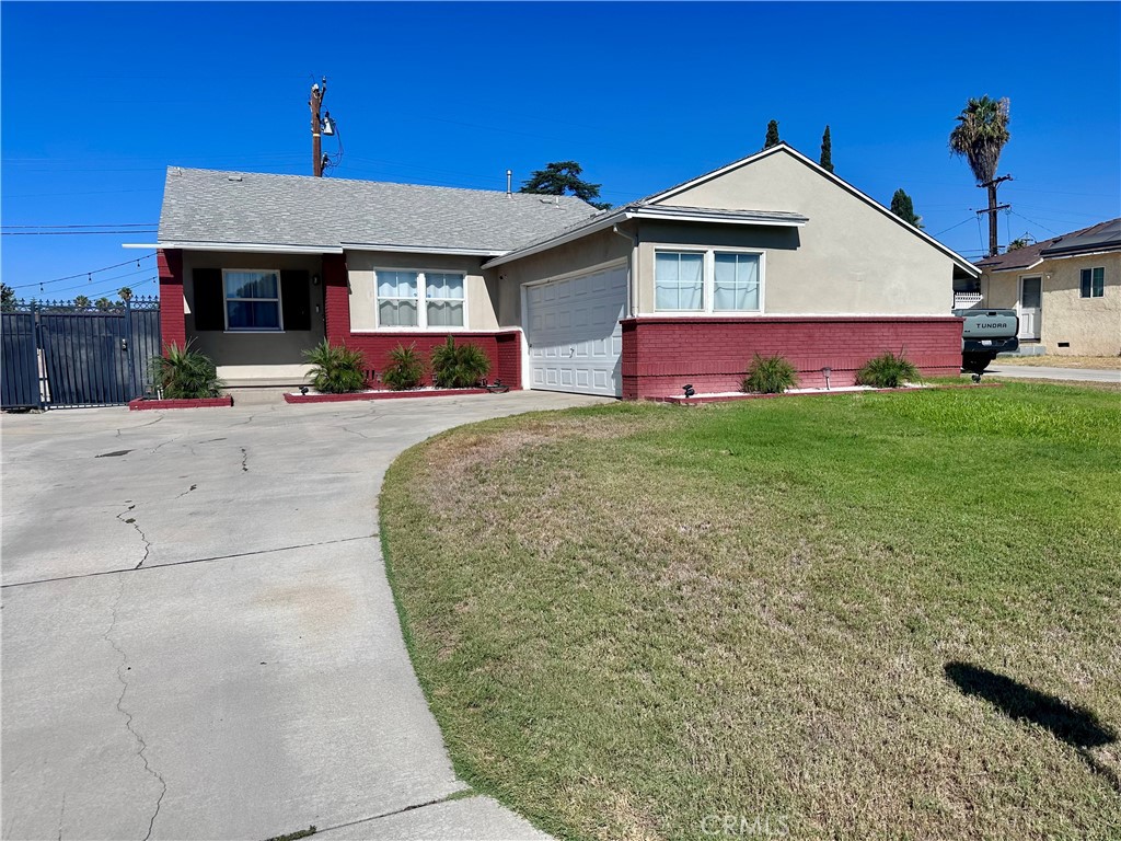 Experience the perfect blend of modern updates and classic charm in this beautifully maintained 3-bedroom, 1.5-bathroom home. Nestled on an expansive 8,200 sq ft lot, this single-story residence offers 1,386 sq ft of living space. The updated kitchen features white cabinetry, quartz countertops, and a deep stainless steel sink. Enjoy the convenience of a 2-car attached garage, RV access, and a spacious backyard ideal for entertaining. Located in a peaceful neighborhood with easy access to schools, shopping, and major freeways.