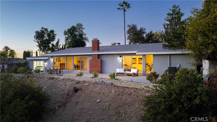 VIEWS! VIEWS! and MORE VIEWS!



Experience timeless elegance at 23112 Cass Avenue—a beautifully restored mid-century modern retreat perched above Woodland Hills with sweeping canyon and mountain vistas. Spanning approximately 2,851 sq. ft., this 4-bedroom, 3-bath home features a 3-bed, 2-bath main residence and a private separate wing with its own entrance, complete with a bedroom and bath—ideal for multigenerational living, guest accommodations, personal use, or flexible rental income opportunities.



This versatile space has been a coveted lease for Pepperdine students, offering exceptional privacy and convenient access to Malibu. Inside, wide-plank floors, open-beam ceilings, and walls of glass showcase classic mid-century design bathed in natural light. A striking stone fireplace anchors the living area, flowing seamlessly to an expansive view terrace—perfect for entertaining or peaceful relaxation.



The chef’s kitchen features quartz countertops, premium stainless appliances, and a sleek modern aesthetic. Nestled south of Ventura Blvd, enjoy effortless access to hiking, biking, and Malibu’s coastal lifestyle—where architectural integrity meets modern California luxury.