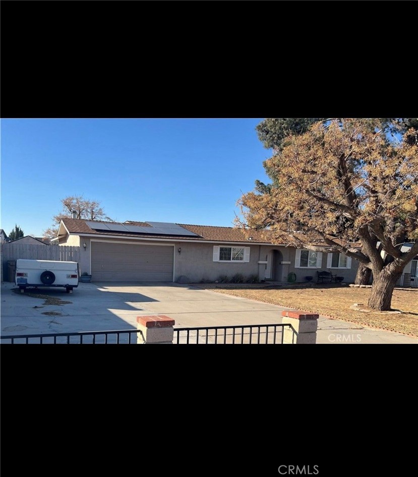 GORGEOUS HOME ! FULLY REMODLED ! WITH SOLAR PAID! Spacious 4bedroom home w/ bonus room! Large lot to park equipment or toys. DUAL PANE WINDOWS, NEWER WATER HEATER, 2 year old A/C AND HEATER, crown molding, enclosed back patio, fenced and cross fenced on 2/3 of an acre. Located just minutes from shopping, City Hall, a movie theater, and a park, this home combines convenience with comfort. CALL TODAY