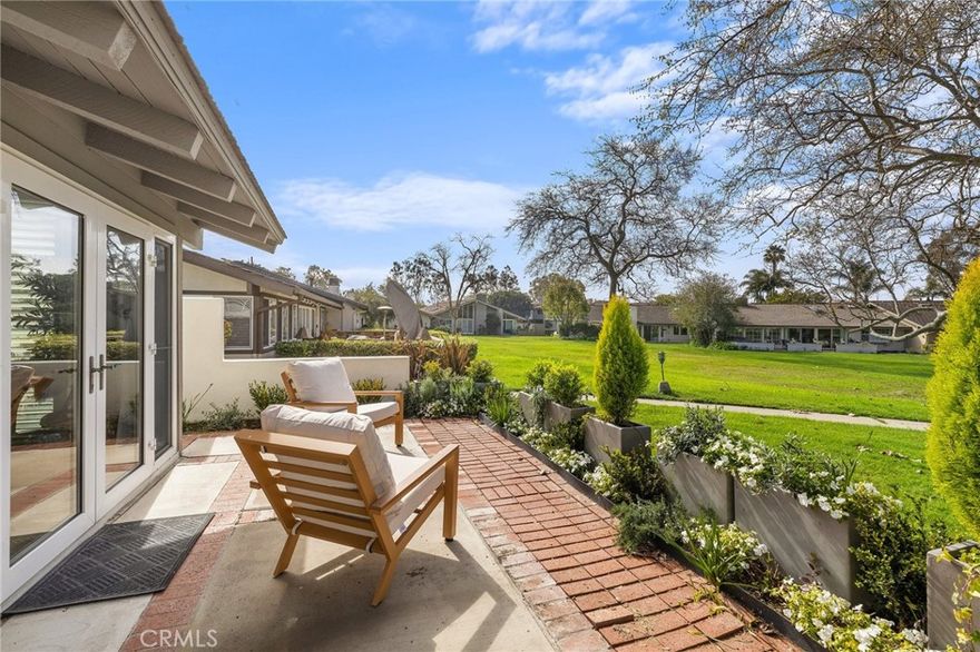 Don't miss out on this expanded end unit Angelita model. This lovely single level home has two bedrooms, two baths plus an office or crafts room. You will love the prime Bluffs location. Enjoy the afternoon sun and park like setting from your spacious back patio. Vaulted wood beamed ceilings compliment  the floor plan. Updated throughout, spacious master suite with a walk-in shower, bench seating and frameless shower enclosure that looks  onto a private atrium. The kitchen has been remodeled with quartz countertops, tiled back splash and current cabinets and appliances. Light wood plank vinyl flooring is water and scratch resistant. Other upgrades include a complete above ground re-plumb, air conditioning, forced air heating and the interior has been freshly painted. The garage walls and ceiling are finished and freshly painted with canned lighting and epoxy flooring. Just steps to one of the two full time heated Community pools.