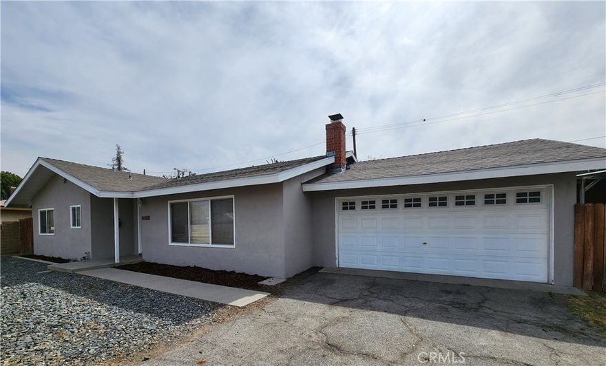 Beautifully remodeled single-story home. This spacious residence features 3 bedrooms and 1.75 bathrooms of comfortable living. The home has been updated from top to bottom, including new paint and wood-style flooring throughout. The kitchen and bathrooms have been remodeled with quartz countertops. Further enhancements include double-pane windows, a fireplace, central air conditioning for year-round comfort, inside laundry room and a two-car garage. Please note that this property is located on a flag lot with a private driveway.