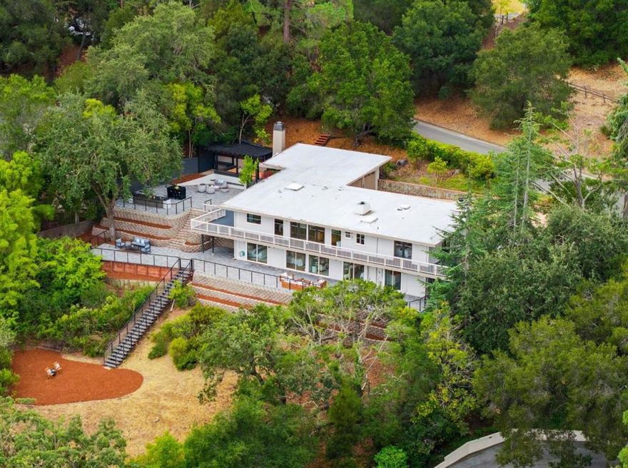 Exquisite architectural home in prestigious Palo Alto Hills with beautiful panoramic views and access to top-ranked schools. Located across from Palo Alto Hills Golf & Country Club, enjoy proximity to championship golf, tennis, clubhouse dining, and vibrant social activities while surrounded by natural serenity. Minutes from Highway 280, this Silicon Valley oasis offers a short drive to leading tech companies. Highly-rated Palo Alto schools including Nixon Elementary, Fletcher Middle, and Gunn High School are nearby (buyer to verify), along with Stanford University. The Foothills Nature Preserve offers endless hiking and biking with stunning vistas, while downtown Palo Alto's shops, restaurants, and cultural venues are just moments away.This thoughtfully updated home features premium finishes, elevated indoor-outdoor living spaces, a versatile bonus room ideal for office or gym, and breathtaking views from multiple vantage points. A rare opportunity balancing secluded tranquility with connectivity to everything Silicon Valley offers, ideal for discerning buyers seeking luxurious living, natural beauty, and educational excellence.